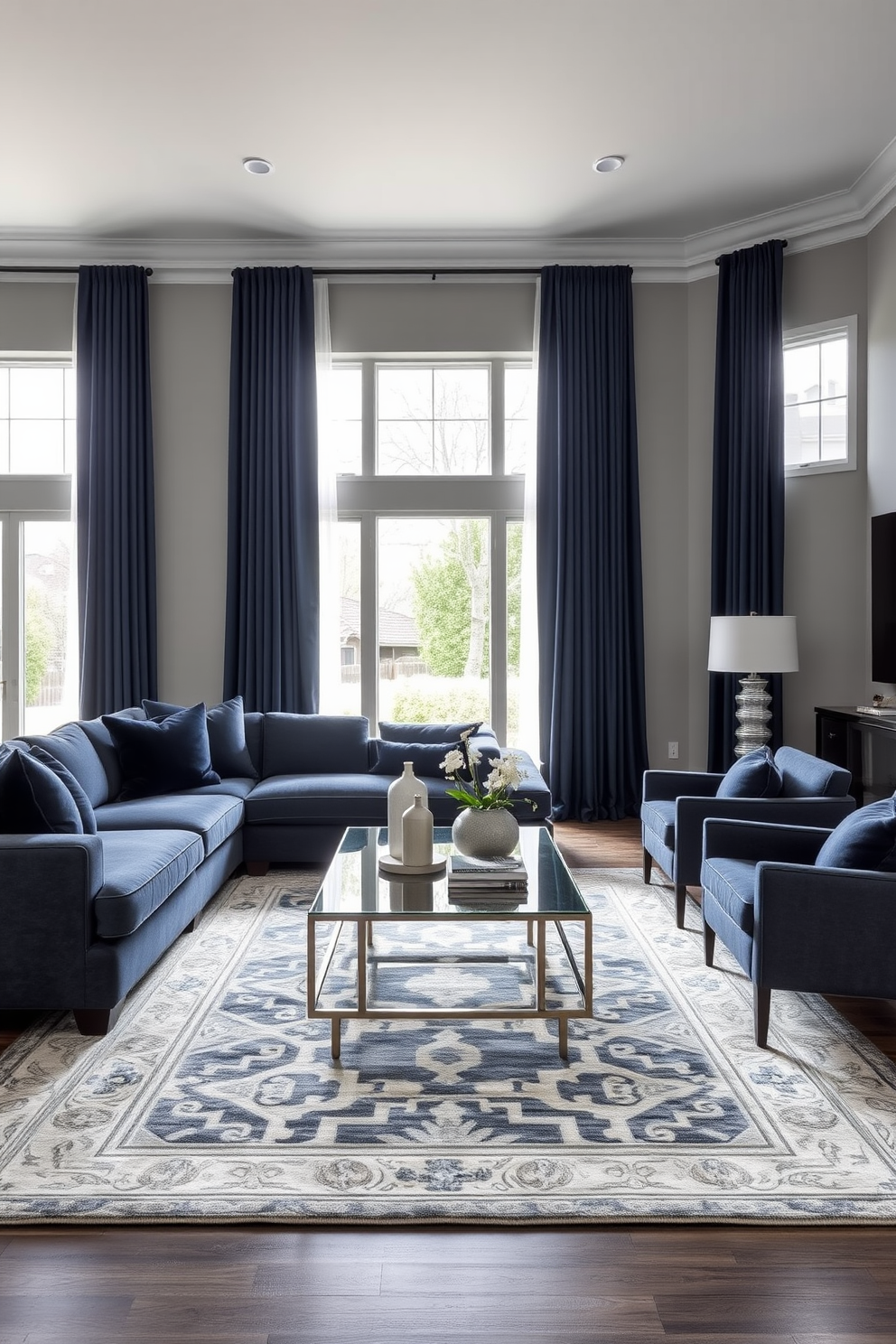 A sophisticated gray living room featuring a plush navy sectional sofa that invites relaxation. The walls are painted in a soft gray hue, complemented by navy accent pillows and a large area rug with geometric patterns. A sleek coffee table made of glass and metal sits in the center, surrounded by stylish armchairs in matching gray tones. Floor-to-ceiling curtains in a rich navy fabric frame the large windows, allowing natural light to filter in while adding an elegant touch.