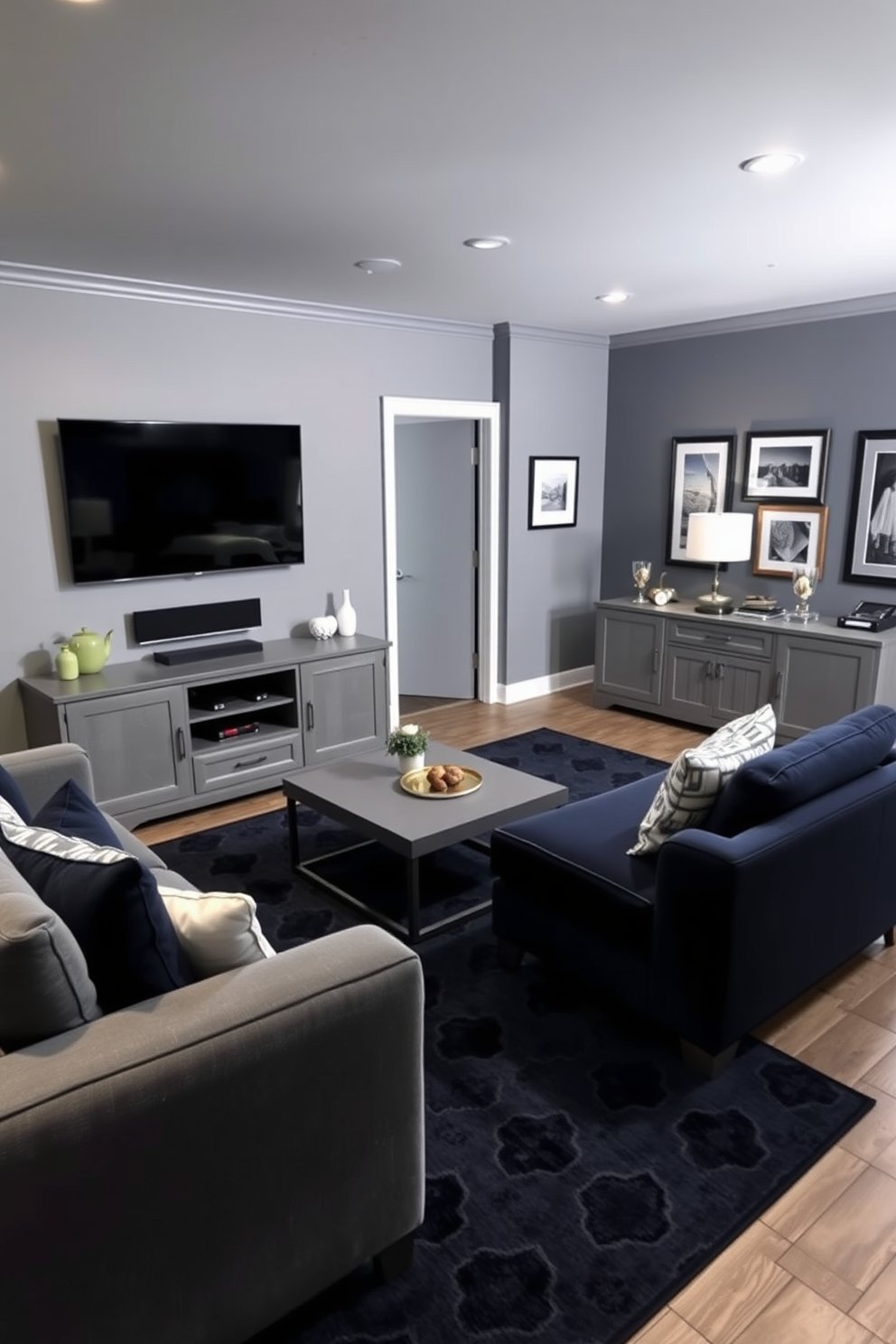 A stylish man cave featuring a gray and navy blue color palette. The room is adorned with a plush navy sectional sofa and a sleek gray coffee table, creating a cozy and inviting space for relaxation. On one wall, a large flat-screen television is mounted above a modern gray entertainment unit. The decor includes framed artwork in complementary shades, and a navy blue rug anchors the seating area, adding warmth and texture to the room.