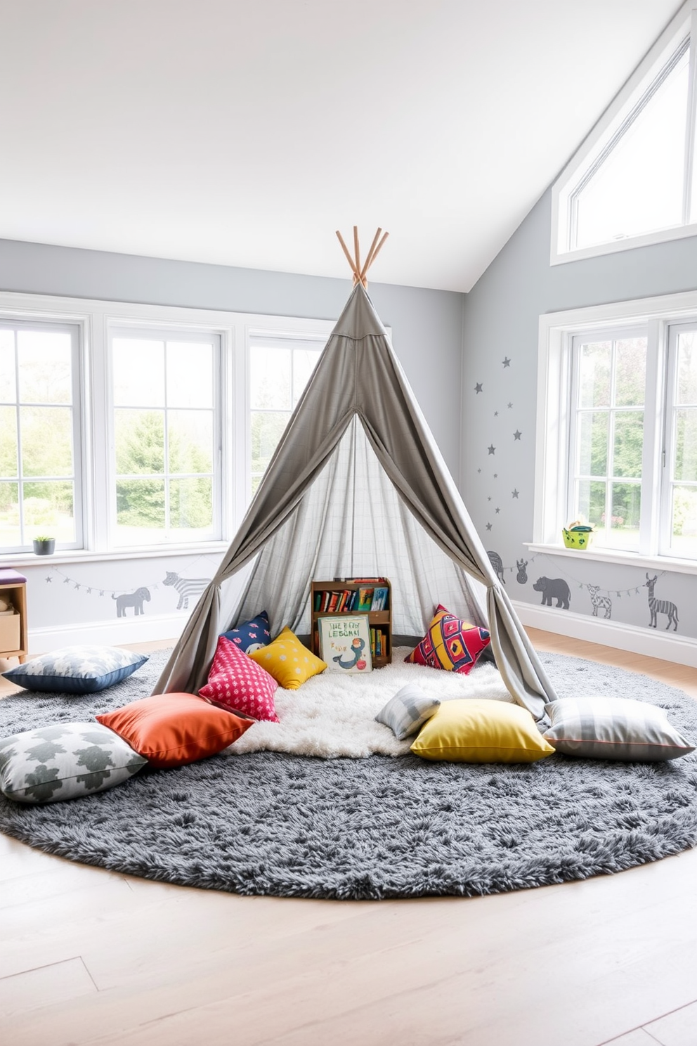 A cozy gray play tent sits in the center of a spacious playroom filled with soft, plush rugs. Surrounding the tent are colorful cushions and a small bookshelf filled with children's books, creating an inviting atmosphere for imaginative play. The walls of the playroom are painted in a light gray hue, complemented by playful wall decals featuring animals and stars. Large windows allow natural light to flood the space, enhancing the cheerful ambiance of the gray playroom design.