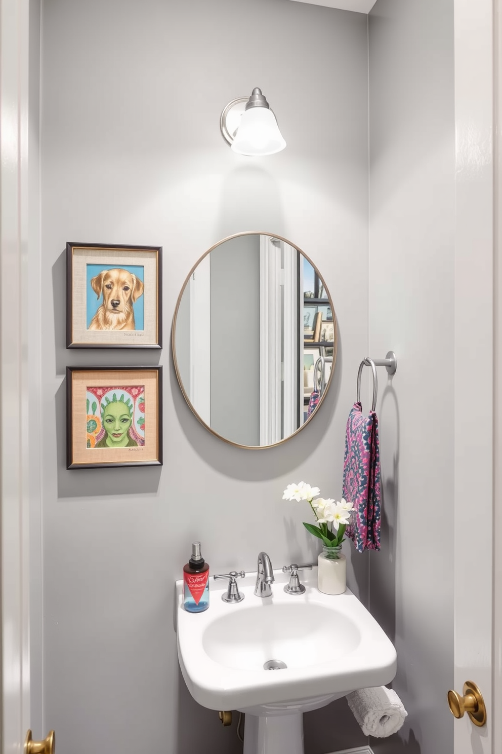 Classic gray wainscoting lines the lower half of the walls, creating a timeless elegance in the powder room. Above the wainscoting, the walls are painted in a soft white, enhancing the brightness and spaciousness of the area. A sleek pedestal sink with a chrome faucet sits against the wall, complemented by a round mirror with a simple gray frame. The floor features a dark hexagonal tile that adds contrast and sophistication to the overall design.