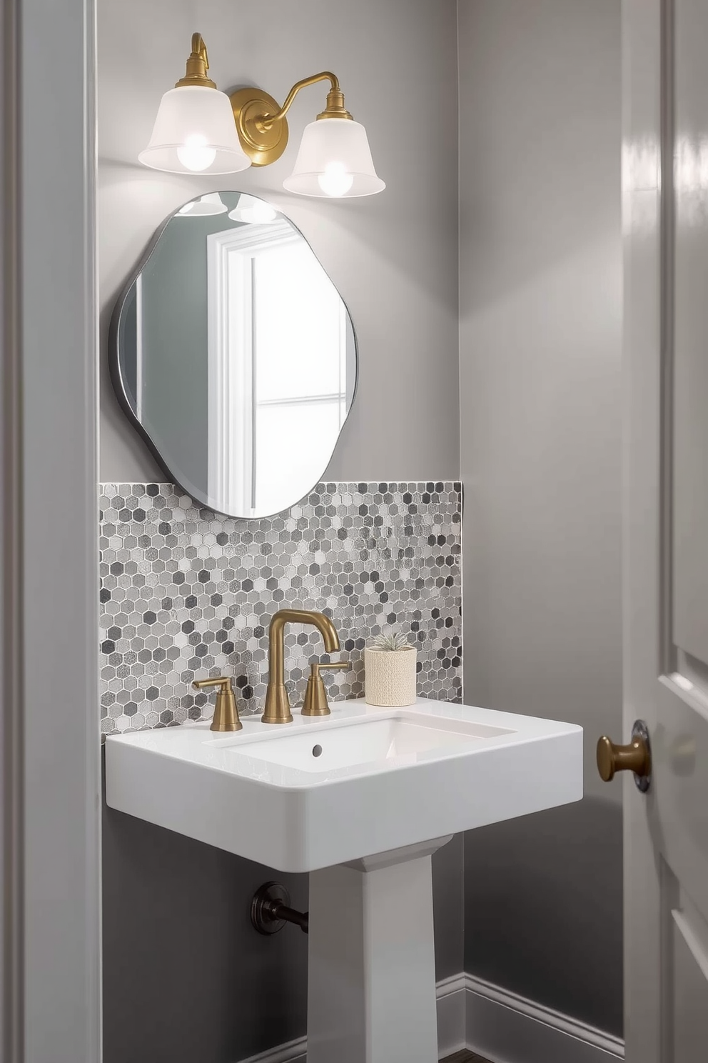 A chic powder room featuring a bold gray and black art piece as the focal point. The walls are painted in a soft gray tone, complementing the sleek black fixtures and a stylish pedestal sink.