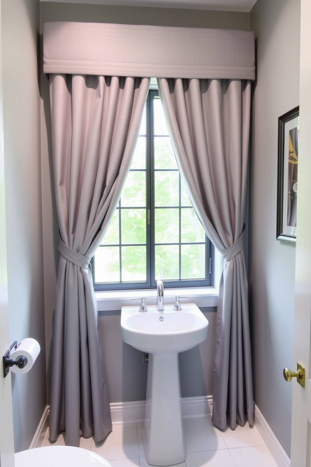 A stylish powder room adorned with soft gray curtains that gently frame a large window. The walls are painted in a light gray tone, complemented by a sleek white pedestal sink and modern fixtures.