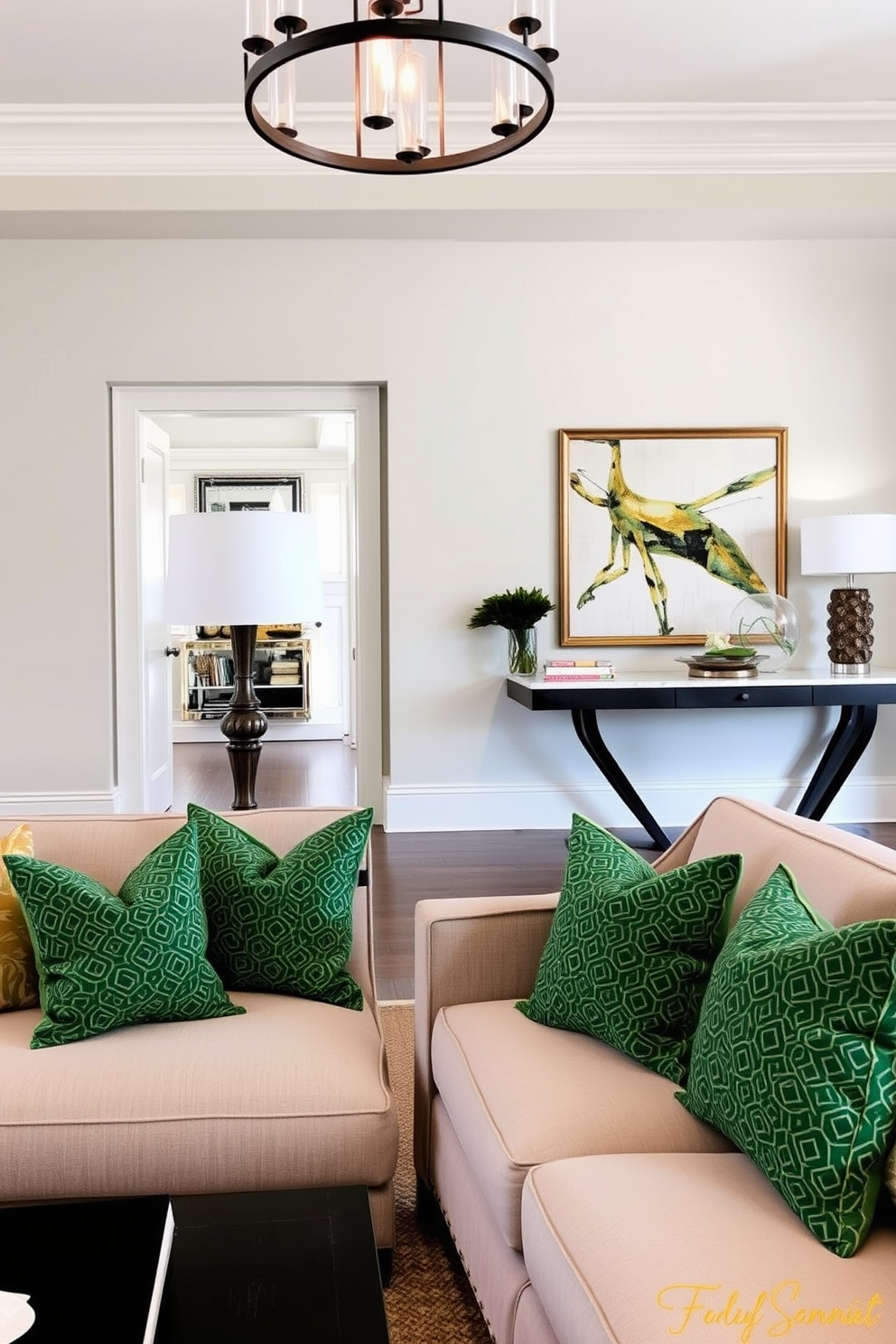 Light green accent wall with molding creates a fresh and inviting atmosphere in the foyer. The space features a stylish console table adorned with decorative objects and a large mirror that enhances the light and openness of the area.