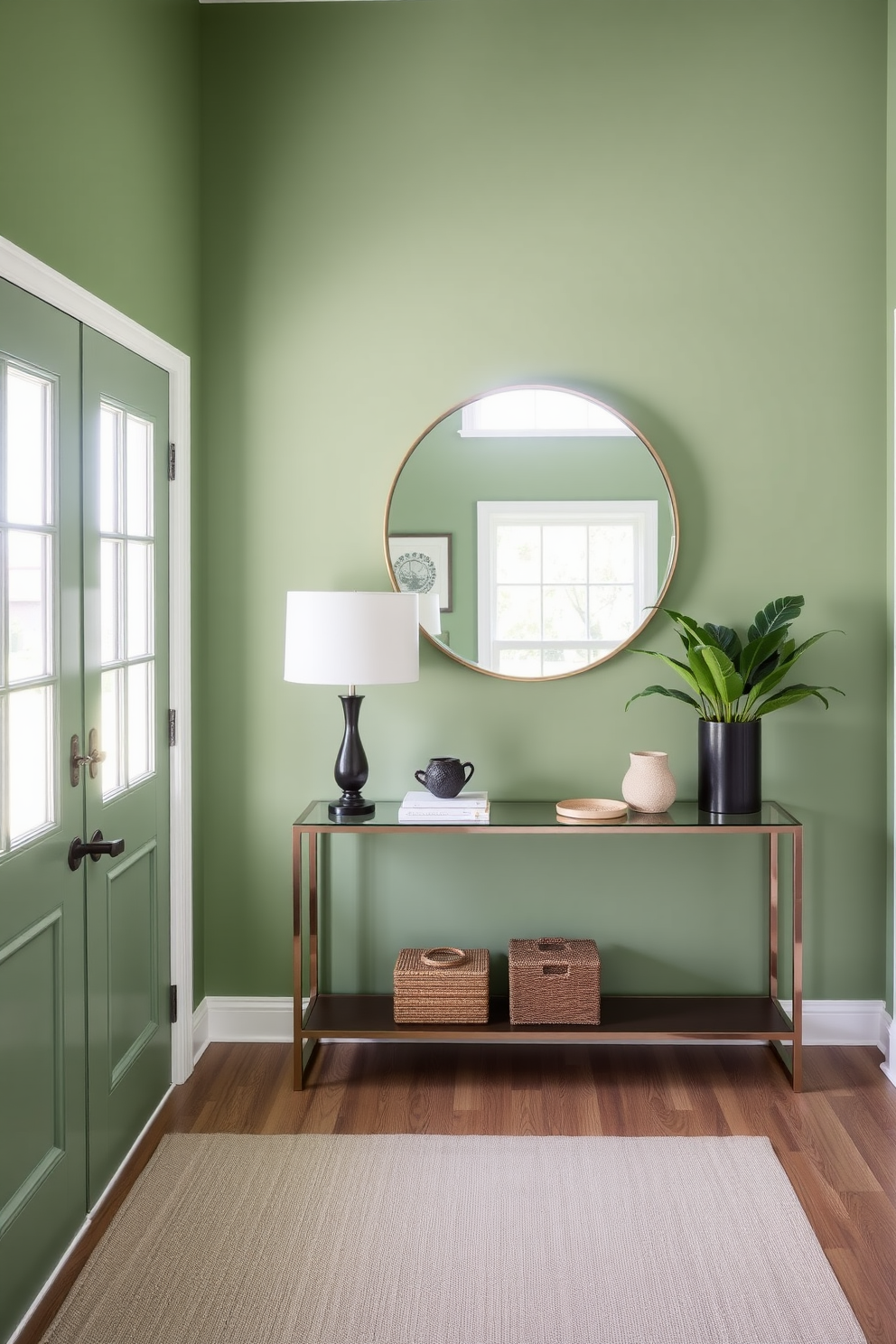 A serene foyer featuring fern green wall paint that creates a calming atmosphere. The space includes a stylish console table topped with decorative items and a large round mirror that reflects natural light.