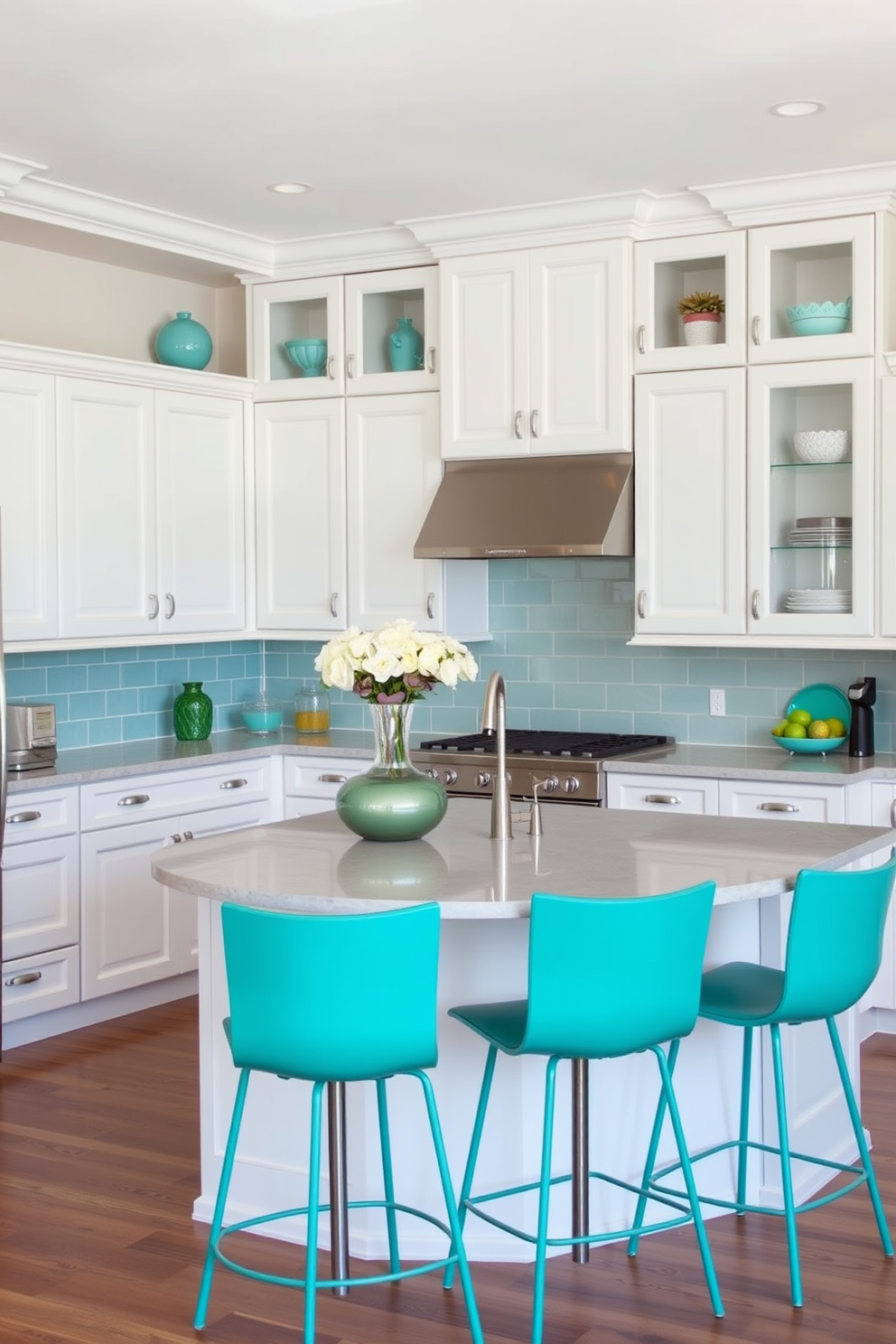 A neutral kitchen setting with teal green accents. The cabinetry is a soft white, complemented by a teal green backsplash and decorative accessories. The countertops are a light gray stone that adds a modern touch. A large island in the center features teal green bar stools for seating, creating a vibrant focal point.