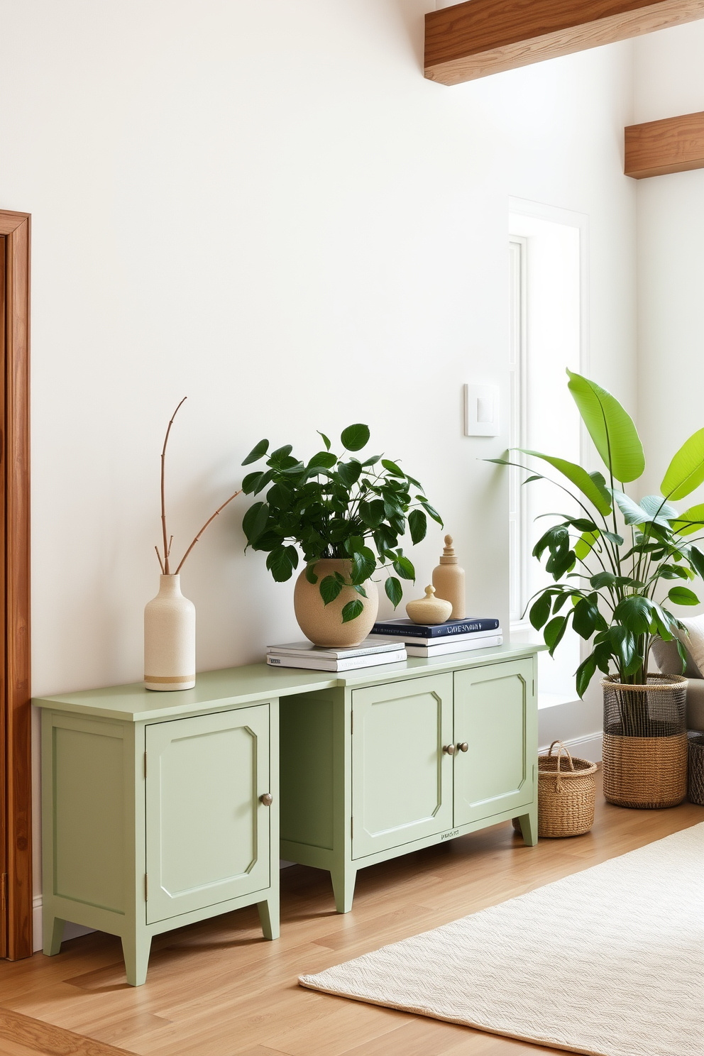 A pastel green sideboard stands against the wall, offering both storage and a stylish accent to the room. The living room features soft, neutral tones and lush greenery, creating a serene and inviting atmosphere.