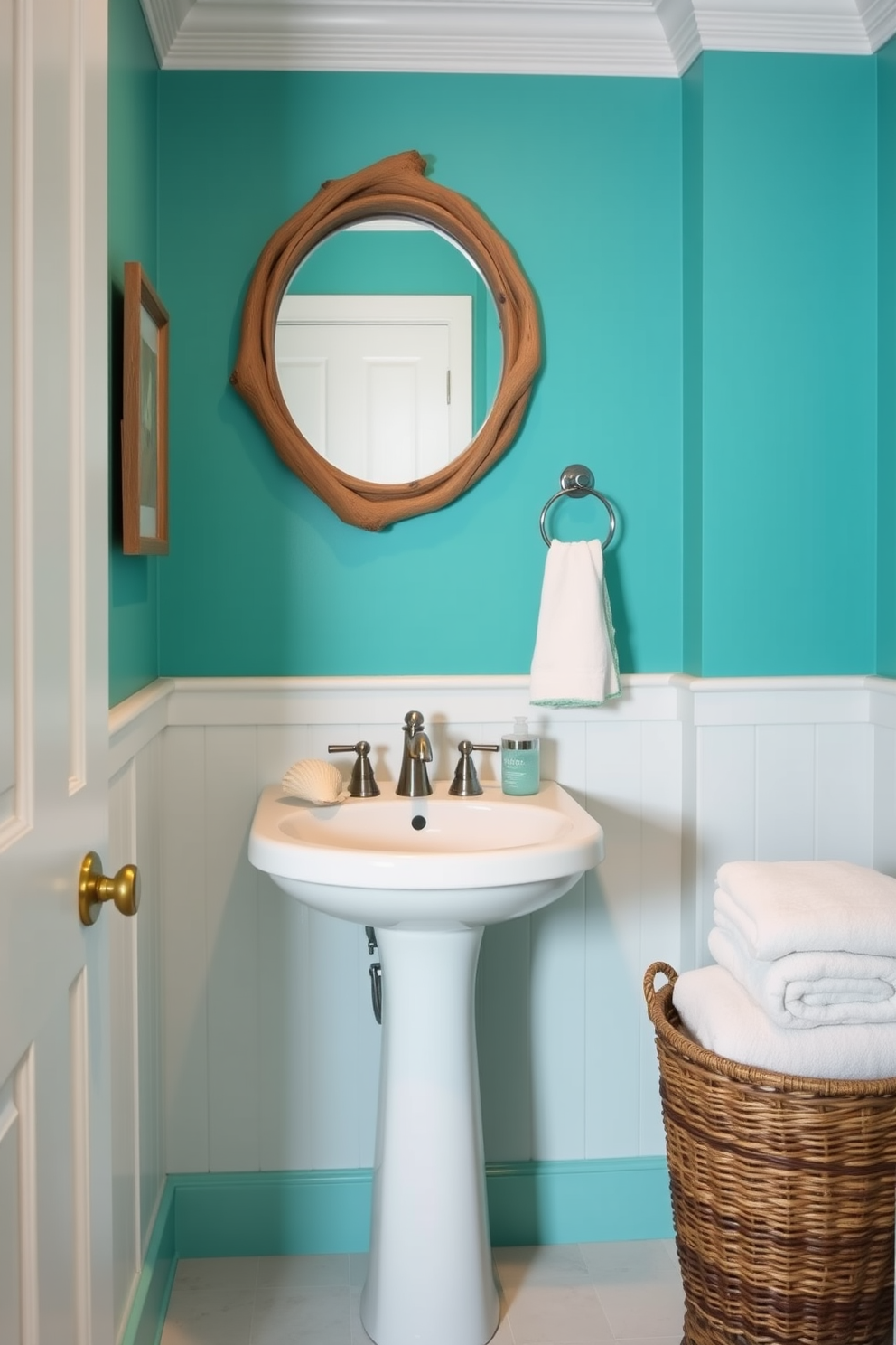 A rich turquoise powder room features coastal decor elements that evoke a serene beach atmosphere. The walls are painted in a vibrant turquoise, complemented by white wainscoting and natural wood accents. A round mirror with a driftwood frame hangs above a sleek white pedestal sink. Nautical-themed accessories, such as a seashell soap dish and a woven basket for towels, add charm to the space.