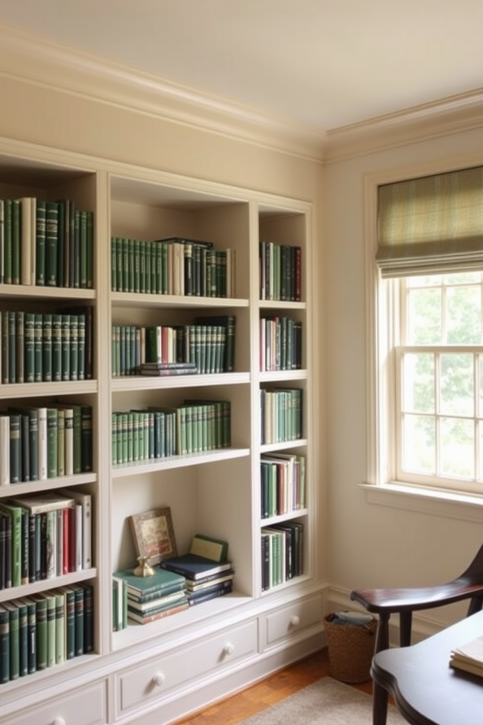 A cozy study room featuring open shelving filled with an array of green books. The walls are painted in a soft cream color, and a large window allows natural light to illuminate the space.