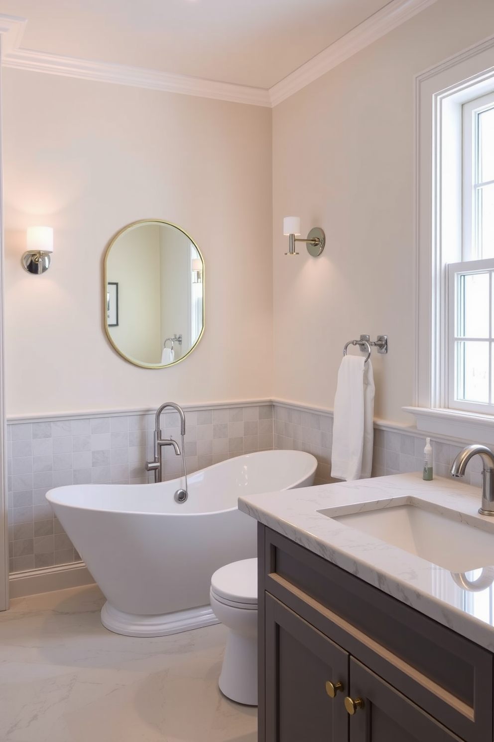 A chic guest bathroom with a monochrome palette. The walls are painted in a sleek soft gray, complemented by black accents throughout the space. A modern freestanding bathtub sits elegantly in the center, surrounded by minimalist decor. The floor features large black tiles that create a striking contrast with the lighter walls.