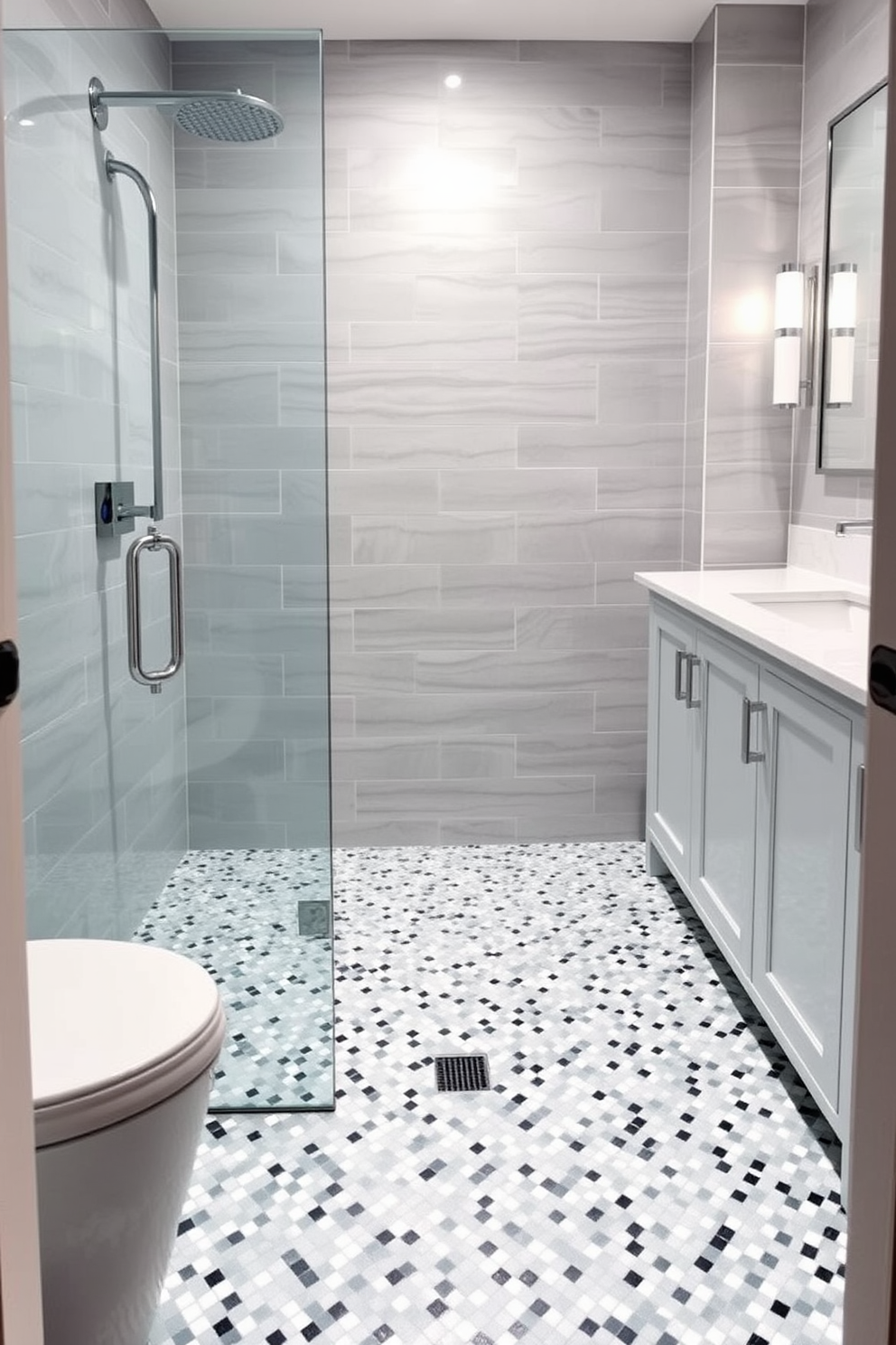 A stylish guest bathroom featuring a glass and marble mosaic shower floor that reflects light beautifully. The walls are adorned with soft gray tiles, and a sleek white vanity complements the elegant design.