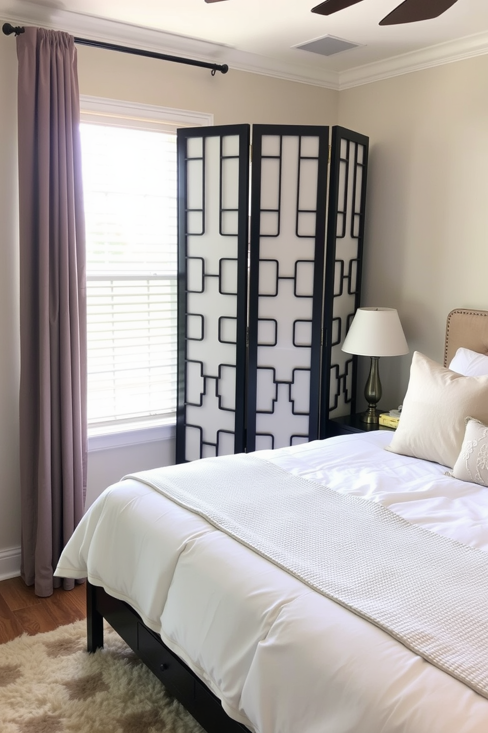 A cozy guest bedroom featuring a stylish folding screen for added privacy. The room is adorned with soft, neutral bedding and a plush area rug, creating a welcoming atmosphere.