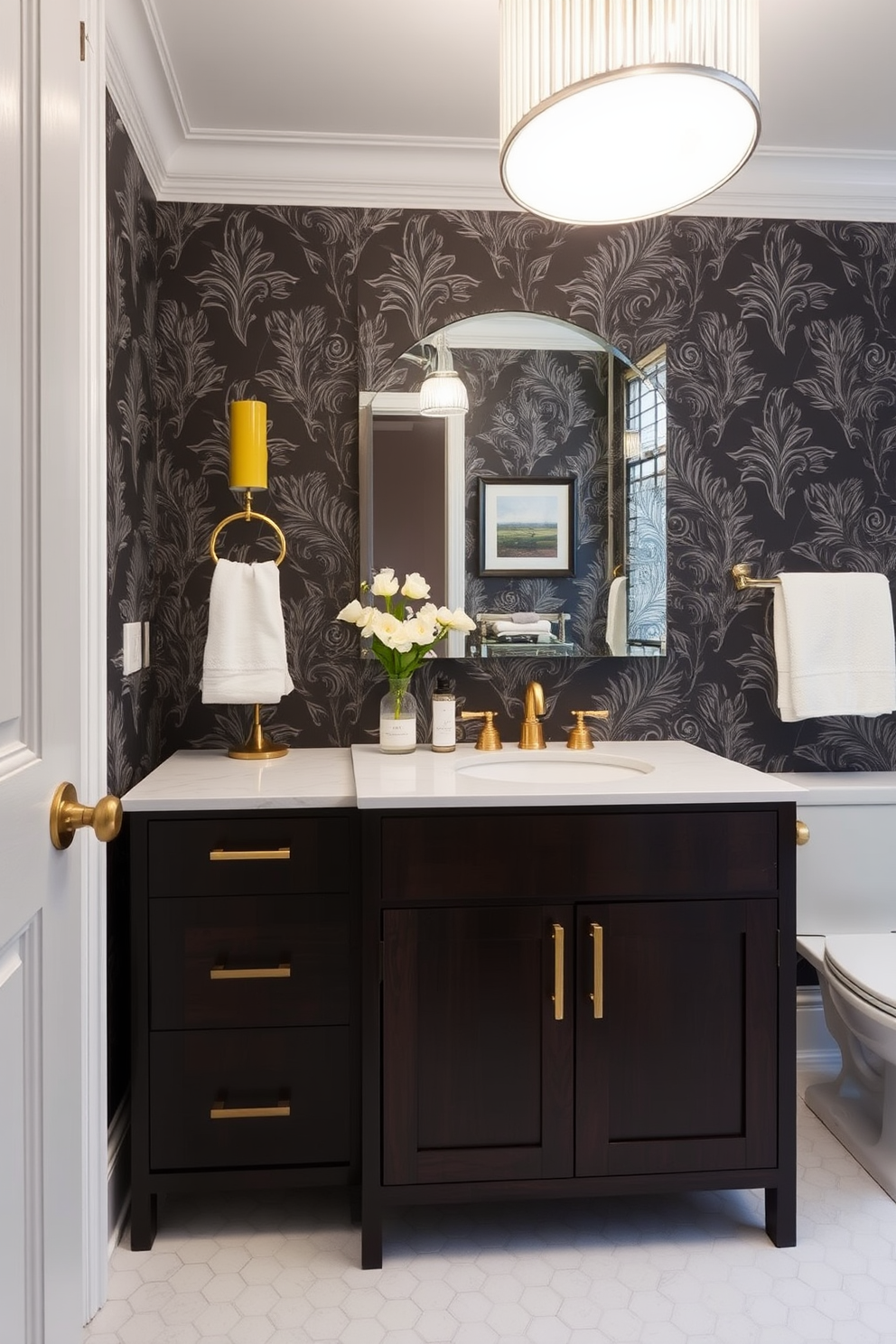 A stylish half bath featuring a statement pendant light as the focal point. The walls are adorned with elegant wallpaper, and the floor is covered in chic hexagonal tiles. The vanity is a sleek design with a dark wood finish, topped with a polished white stone surface. Accents of gold in the fixtures and accessories add a touch of luxury to the space.