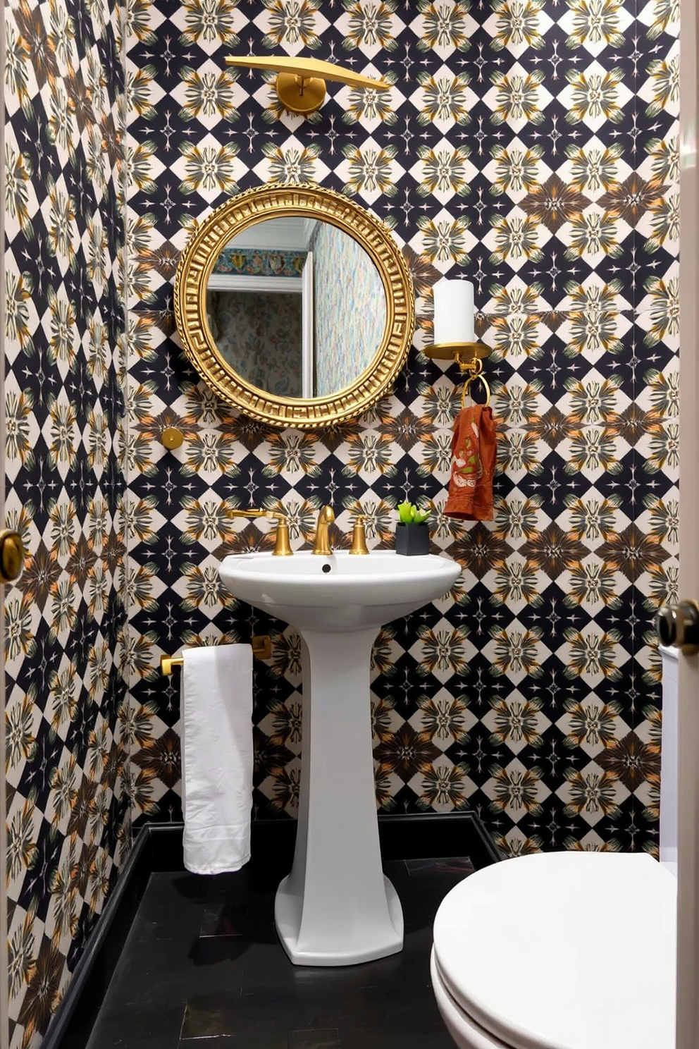 A bold wallpaper with an intricate geometric pattern covers the walls, creating a striking focal point in the space. The half bathroom features a sleek pedestal sink paired with a modern faucet, complemented by elegant brass accents throughout. A round mirror with a decorative frame hangs above the sink, reflecting the vibrant wallpaper. The floor is adorned with dark-colored tiles, providing a chic contrast to the lively walls and enhancing the overall dramatic flair.