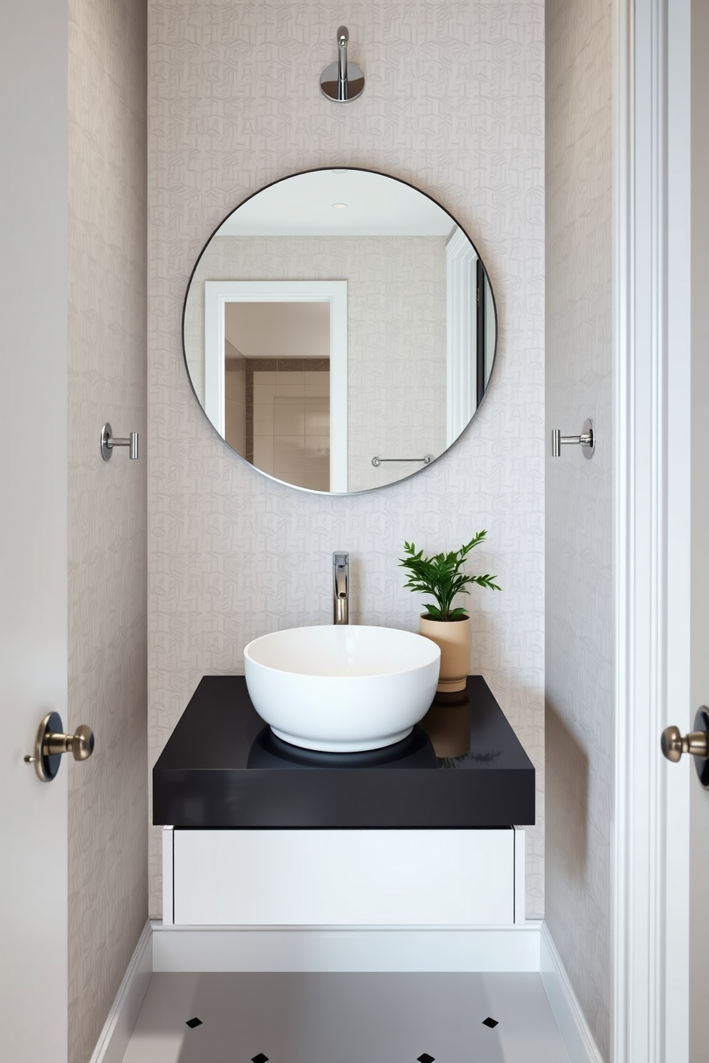 A stylish half bathroom featuring wall-mounted faucets to save space. The design includes a sleek floating vanity with a minimalist sink and a large round mirror above it. The walls are adorned with elegant wallpaper in a subtle geometric pattern. A small potted plant sits on the vanity, adding a touch of greenery to the sophisticated atmosphere.