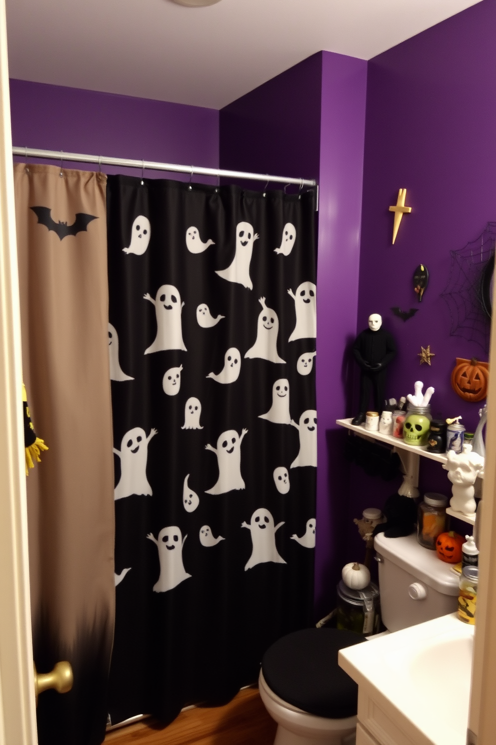 A Halloween-themed bathroom features a shower curtain adorned with spooky spiderwebs that create an eerie atmosphere. The space is accented with orange and black decorations, including ghostly figures and miniature pumpkins placed around the sink and on the shelves.