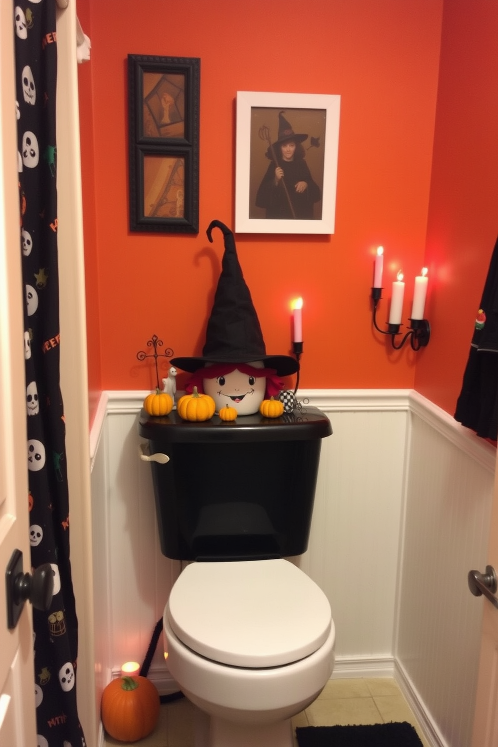 A whimsical Halloween bathroom setting features a black toilet tank adorned with a decorative witch hat perched on top. Surrounding the tank, spooky accents like miniature pumpkins and ghostly figures create a festive atmosphere. The walls are painted in a deep orange hue, complemented by black and white accents throughout the space. A shower curtain with a playful Halloween pattern adds to the overall theme, while flickering LED candles provide a warm, eerie glow.