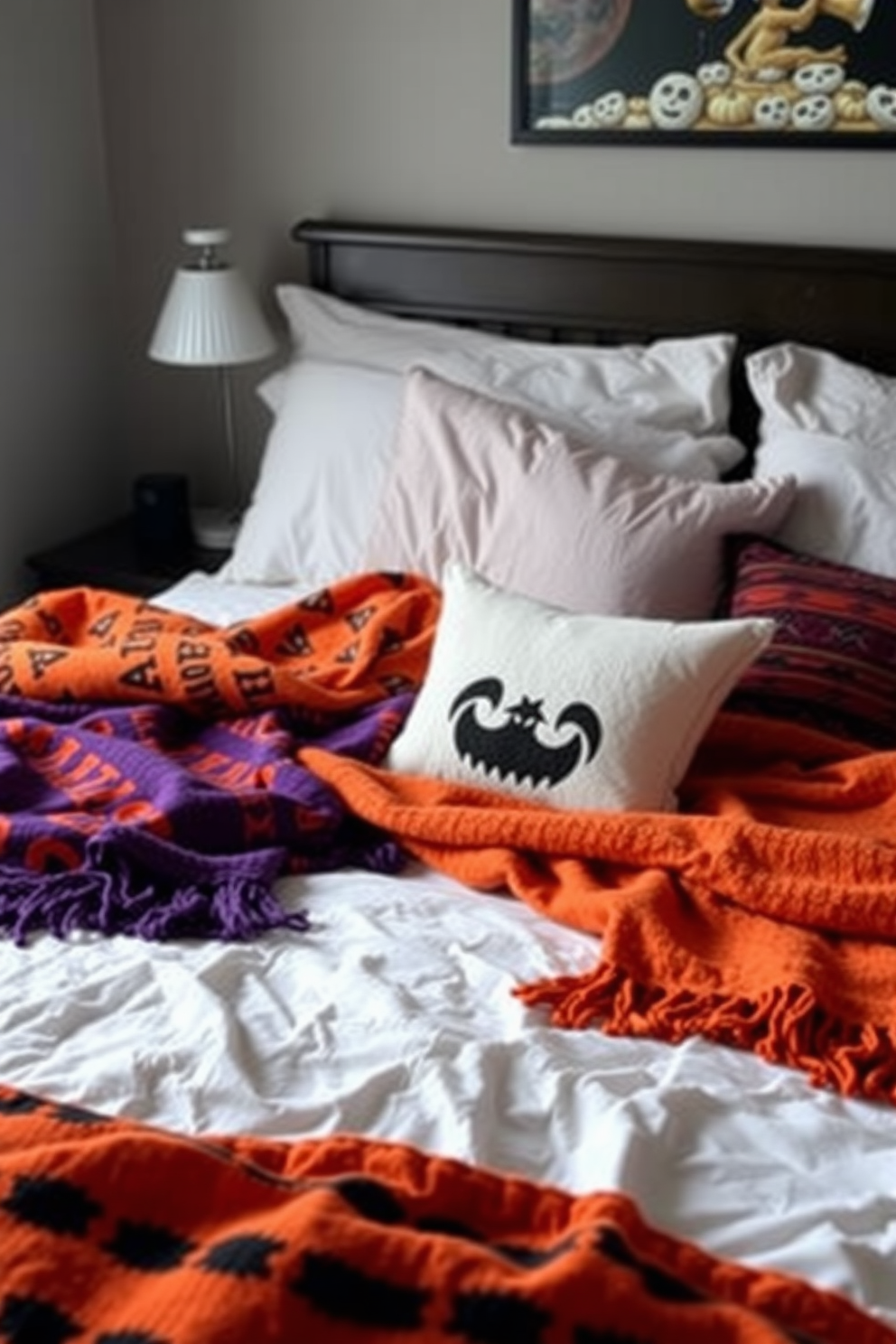 A cozy bedroom setting featuring soft patterned throws in vibrant Halloween colors. The bed is adorned with a mix of orange, purple, and black textiles, creating a festive yet inviting atmosphere.