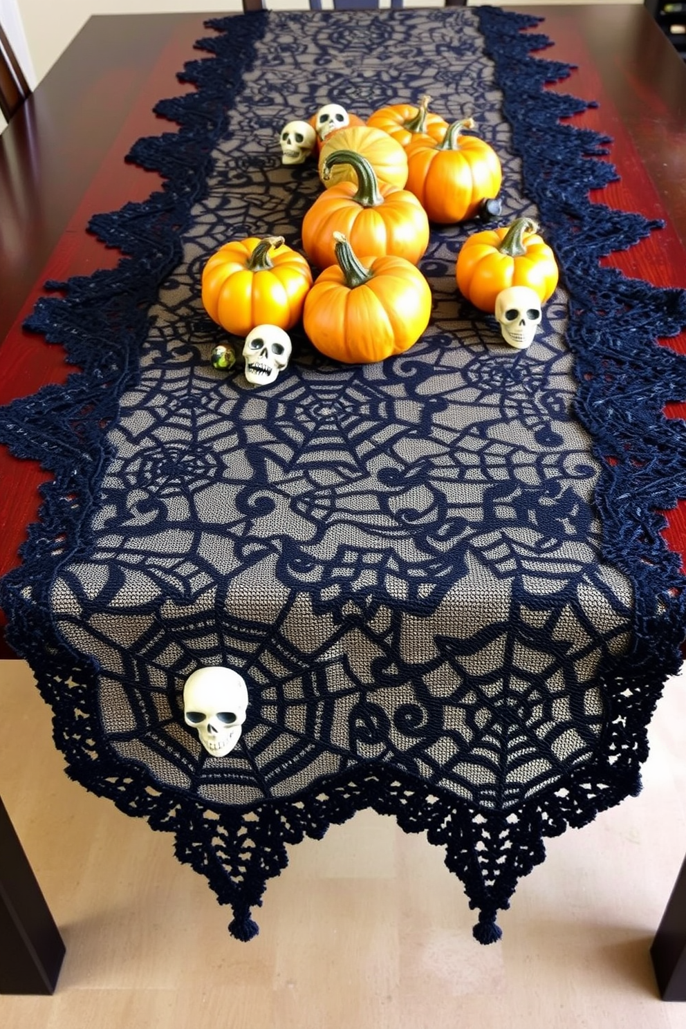 A spooky table runner design featuring dark lace and intricate spider web patterns. The runner is adorned with small skulls and pumpkins, creating an eerie yet elegant atmosphere for Halloween dining room decor.