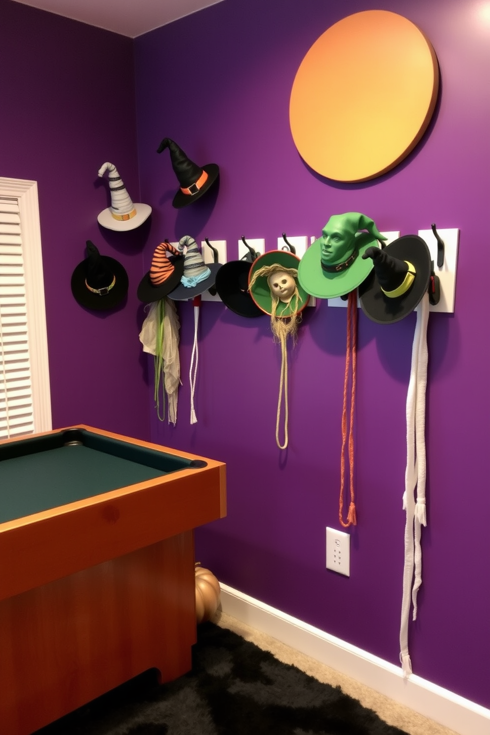 A whimsical game room featuring wall hooks adorned with various witch hats in different styles and colors. The walls are painted in a deep purple, and the floor is covered with a cozy black rug to enhance the Halloween atmosphere.