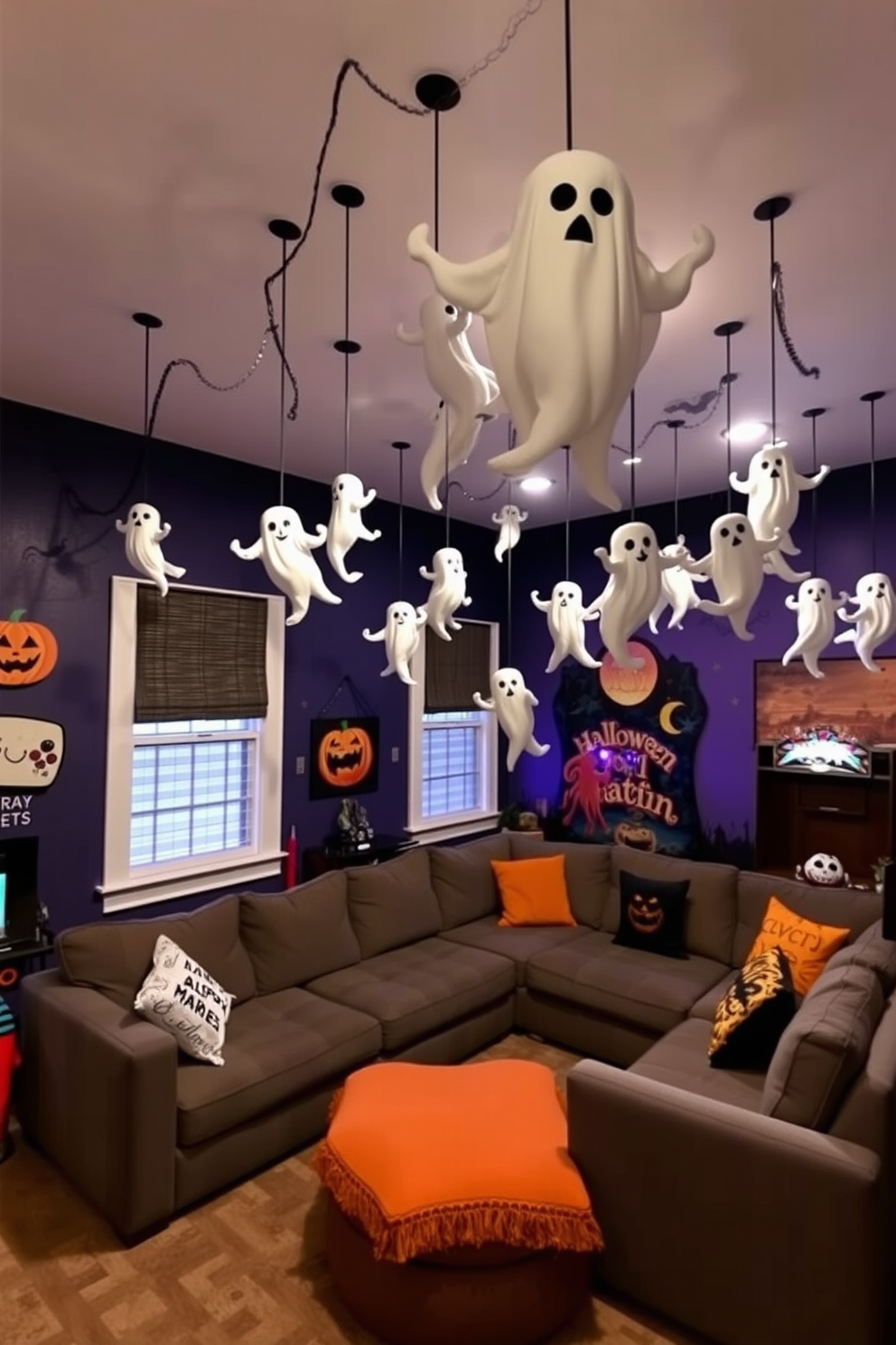 A playful Halloween game room features hanging ghost decorations from the ceiling, creating a spooky yet fun atmosphere. The walls are adorned with vibrant Halloween-themed artwork, and a large, cozy sectional sofa invites guests to gather and enjoy the festivities.