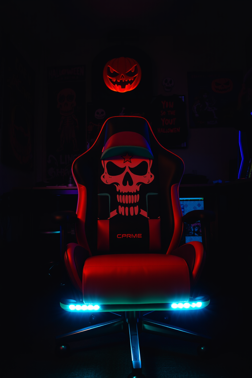 A themed gaming chair featuring a striking skull design sits prominently in a dimly lit game room. Surrounding the chair are walls adorned with Halloween-themed artwork, and eerie lighting casts shadows that enhance the spooky atmosphere.