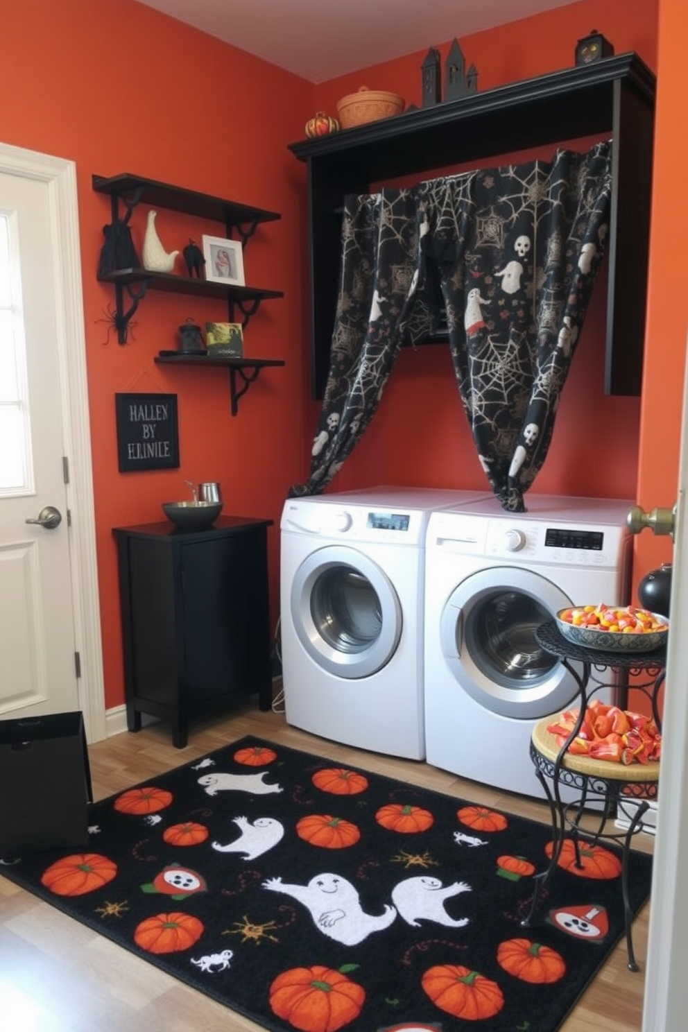 A Halloween themed laundry room features a cozy rug adorned with playful ghosts and pumpkins. The walls are painted in a deep orange hue, complemented by black shelving displaying seasonal decor like cobwebs and spider figurines. The laundry machines are tucked away behind a curtain with a spooky print, creating a festive yet functional space. A small table in the corner holds a bowl of candy, welcoming visitors with a touch of holiday spirit.