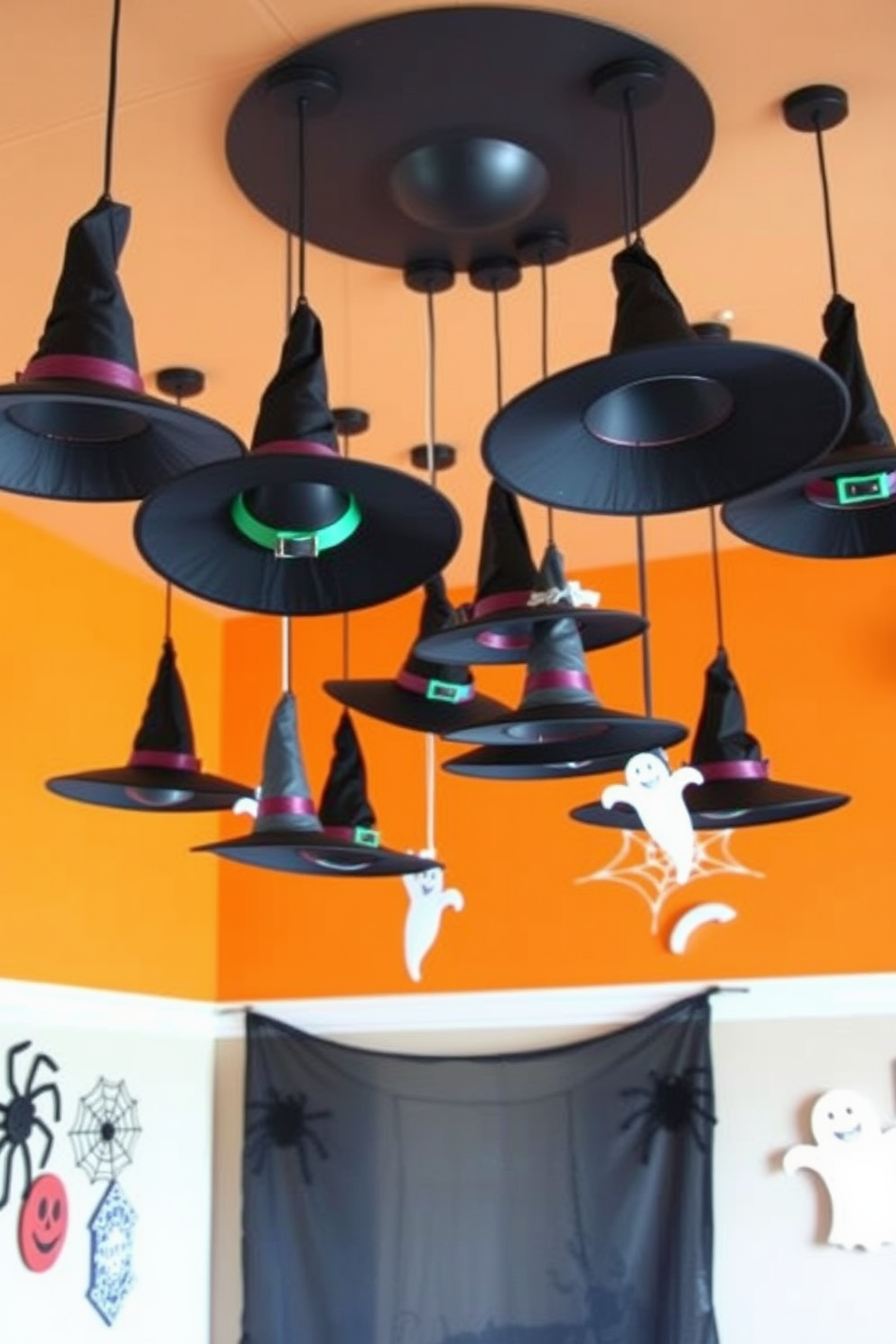 Create a whimsical Halloween playroom featuring hanging witch hats from the ceiling. The walls are painted in a vibrant orange, and playful decorations like spider webs and ghost cutouts adorn the space.