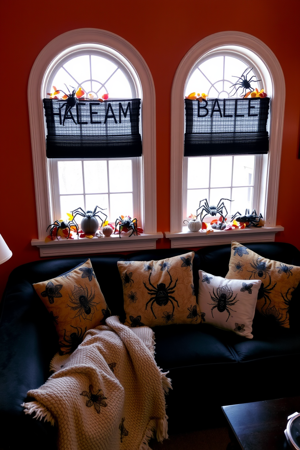 Creepy crawly decor adorns the window sills of a small living room, featuring realistic spider and insect figurines nestled among autumn leaves. The walls are painted in a deep orange hue, while a cozy black sofa is accented with themed throw pillows and a plush blanket for an inviting yet spooky atmosphere.