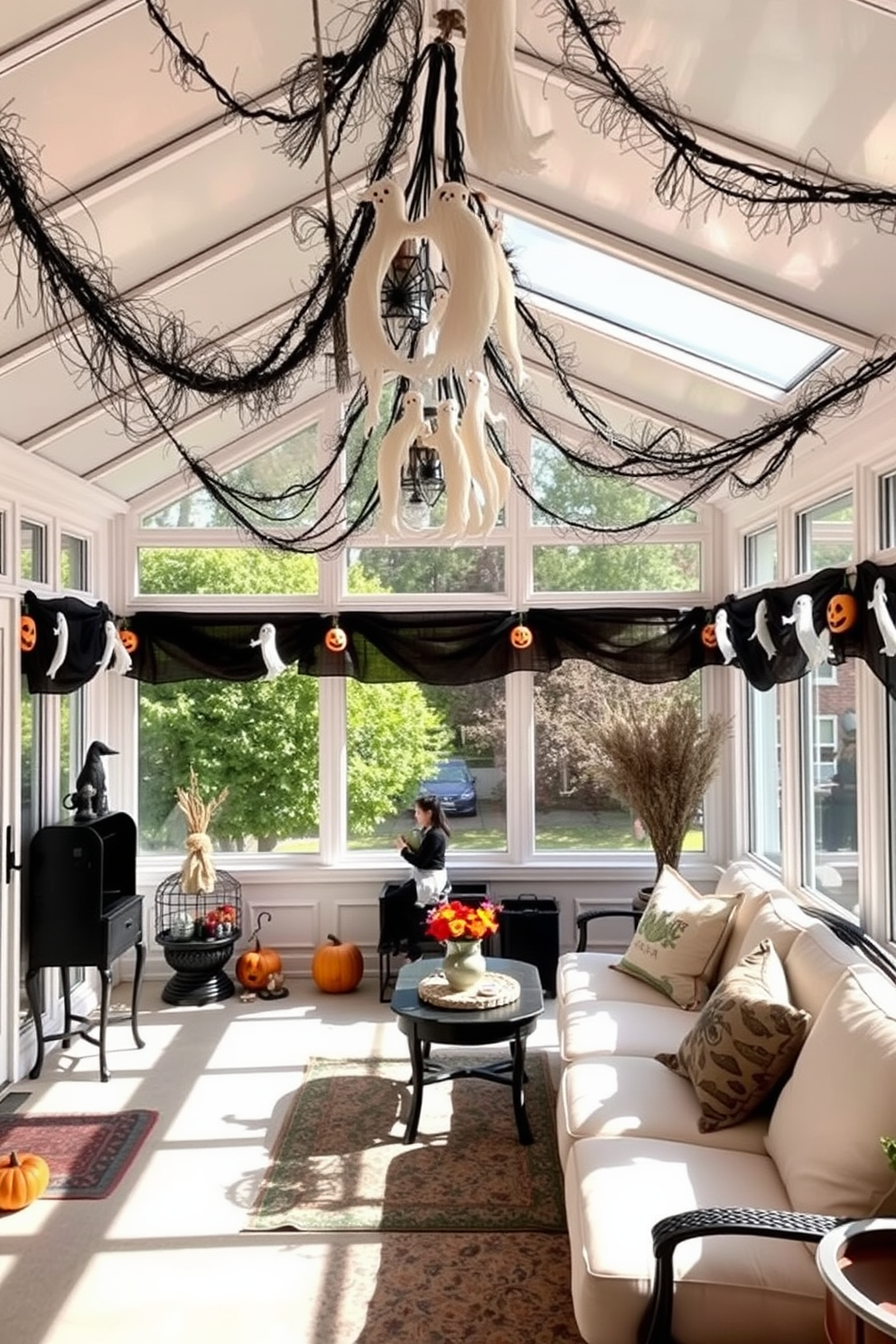 A cozy sunroom decorated for Halloween features a comfortable seating area adorned with black and orange throw pillows. Large windows allow natural light to flood the space, while autumn-themed decorations like small pumpkins and spooky lanterns enhance the festive atmosphere.