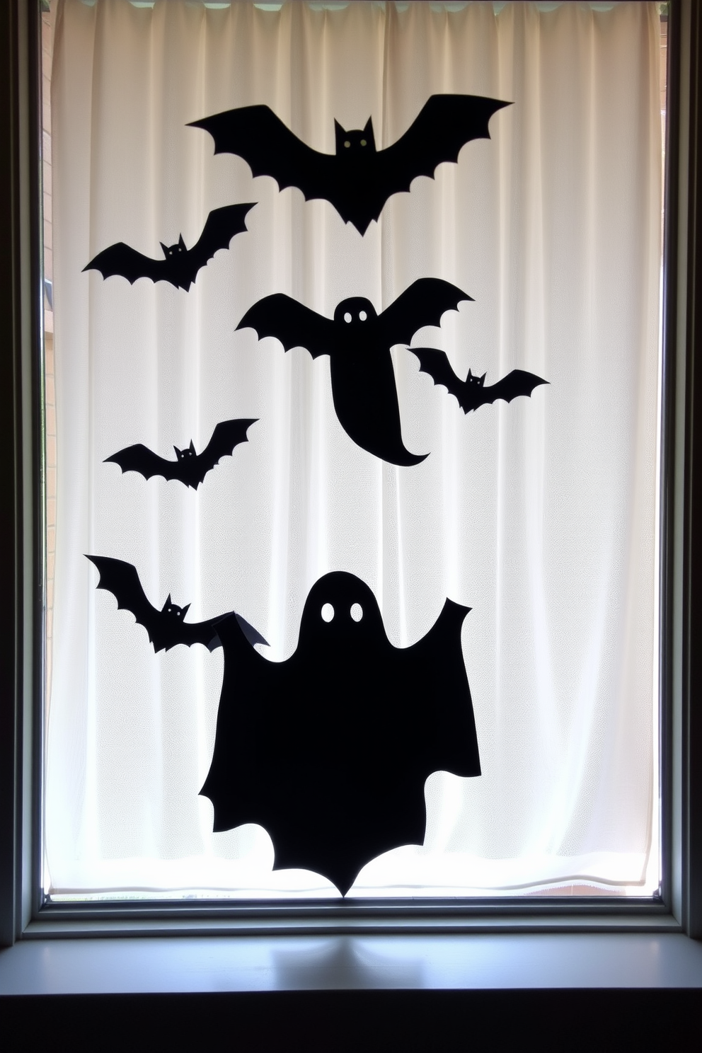 Spooky silhouettes of ghosts and bats are displayed in the window, creating an eerie atmosphere for Halloween. The silhouettes are crafted from black cardstock and are strategically placed to catch the light, enhancing their ghostly appearance.