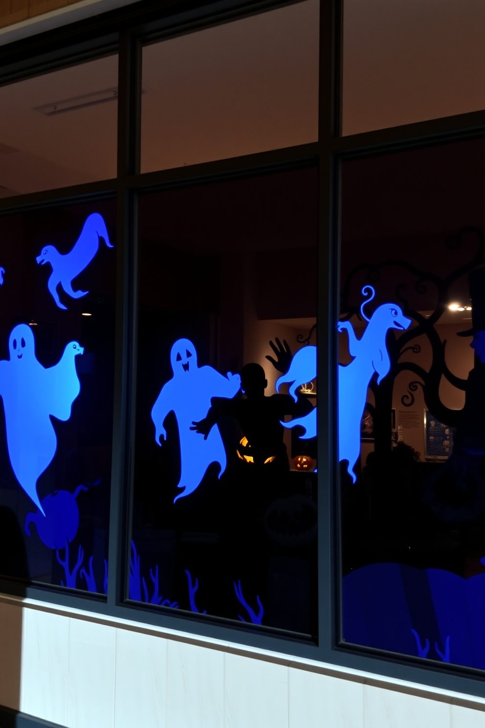 A spooky window display features hanging chains that create a haunting atmosphere. Wispy black fabric drapes around the edges, enhancing the eerie vibe of the Halloween theme.