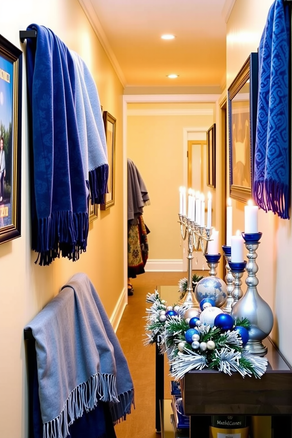 A cozy hallway adorned with seasonal throw blankets in various shades of blue. The walls are lined with elegant artwork, and soft lighting casts a warm glow over the space. Festive Hanukkah decorations are tastefully arranged along a console table. A menorah sits prominently in the center, surrounded by blue and silver accents that enhance the holiday spirit.