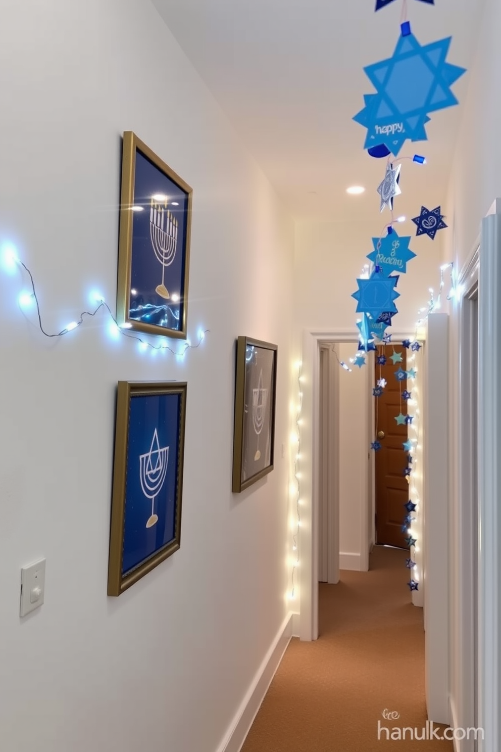 Hanukkah themed wall art prints featuring vibrant blue and gold colors with traditional symbols like menorahs and dreidels. The prints are displayed in elegant frames on a soft white wall, creating a festive atmosphere. Hallway Hanukkah decorating ideas include string lights with blue and white hues draped along the walls. Decorative garlands made of paper stars and dreidels hang from the ceiling, inviting guests into the celebratory space.