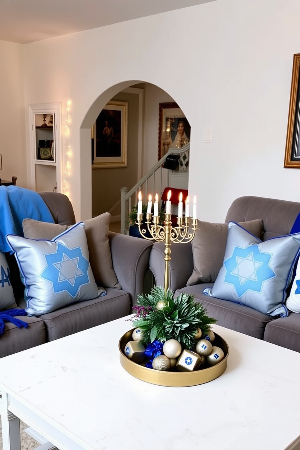 Hanukkah themed pillows are arranged on plush sofas, featuring blue and silver designs that evoke the spirit of the holiday. The cozy living room is adorned with twinkling string lights and a beautifully decorated menorah on the coffee table, creating a warm and inviting atmosphere. The sofas are complemented by soft throws in festive colors, enhancing the seasonal decor. A vibrant centerpiece with dreidels and candles adds a touch of elegance to the space, celebrating the joy of Hanukkah.