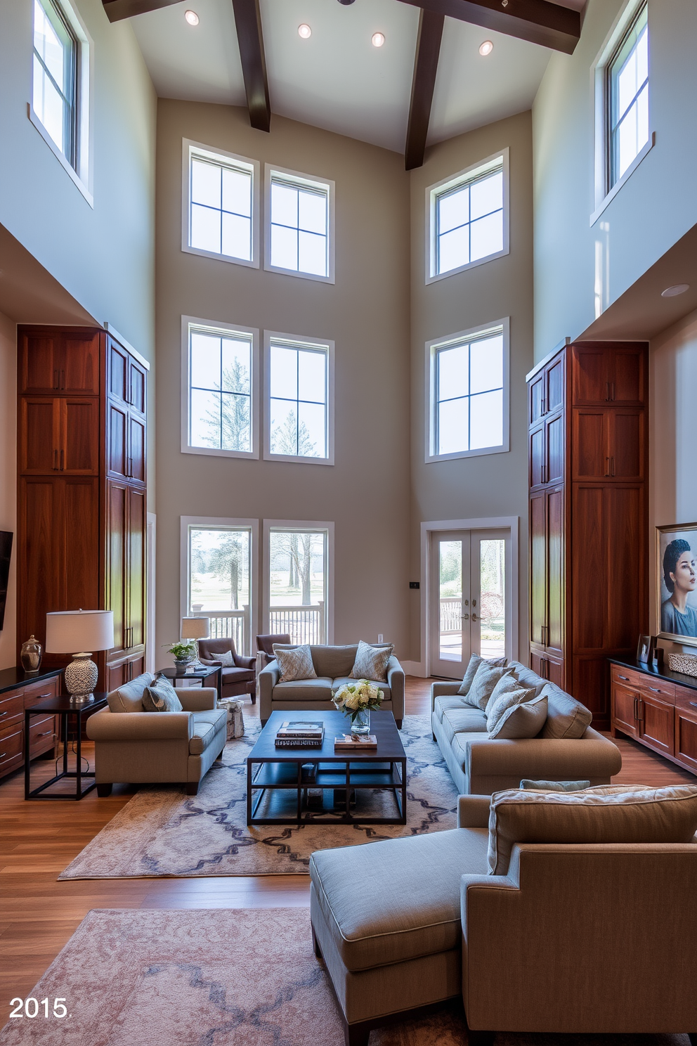 A spacious living room with high ceilings featuring custom cabinetry that blends seamlessly with the overall design. The cabinetry is finished in a rich wood tone, providing ample storage while enhancing the room's elegance and functionality. Large windows allow natural light to flood the space, highlighting the airy atmosphere. Plush seating arrangements create a cozy yet sophisticated gathering area, complemented by tasteful decor and artwork on the walls.