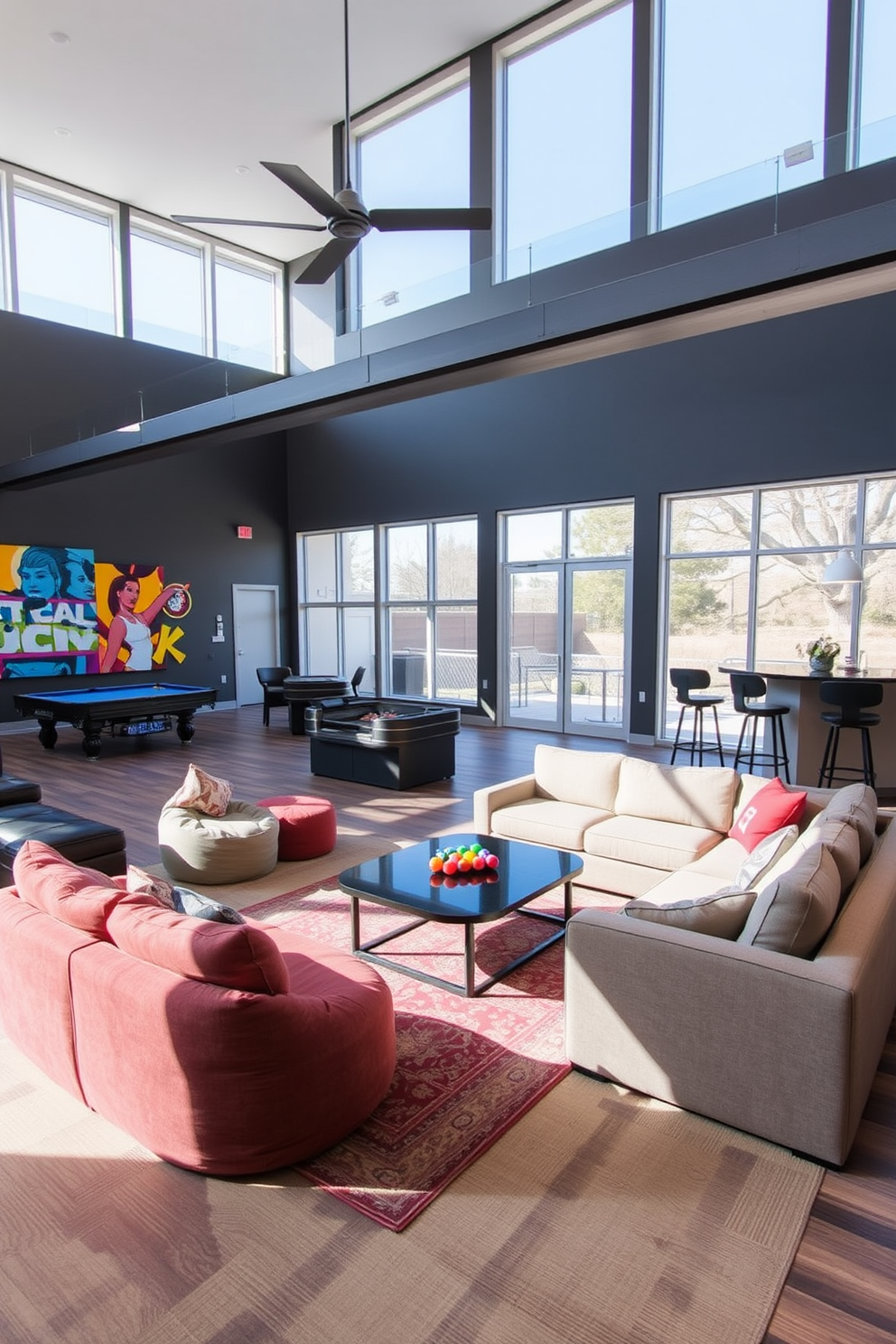 An open layout game room designed for social interaction features large windows that allow natural light to fill the space. Comfortable seating arrangements, including a sectional sofa and bean bags, are positioned around a central coffee table for easy conversation and relaxation. The room includes a pool table and a gaming console area, with vibrant wall art that reflects a playful atmosphere. A wet bar with high stools is situated in one corner, providing refreshments for guests while maintaining an inviting and lively ambiance.