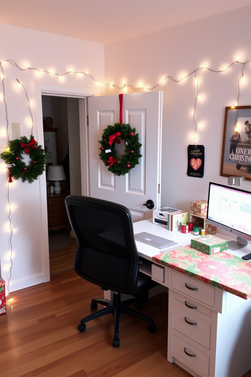 A bright and cheerful home office decorated for Christmas features a large desk adorned with vibrant wrapping paper in shades of red, green, and gold. String lights drape across the walls, adding a warm glow to the space, while a festive wreath hangs on the door.