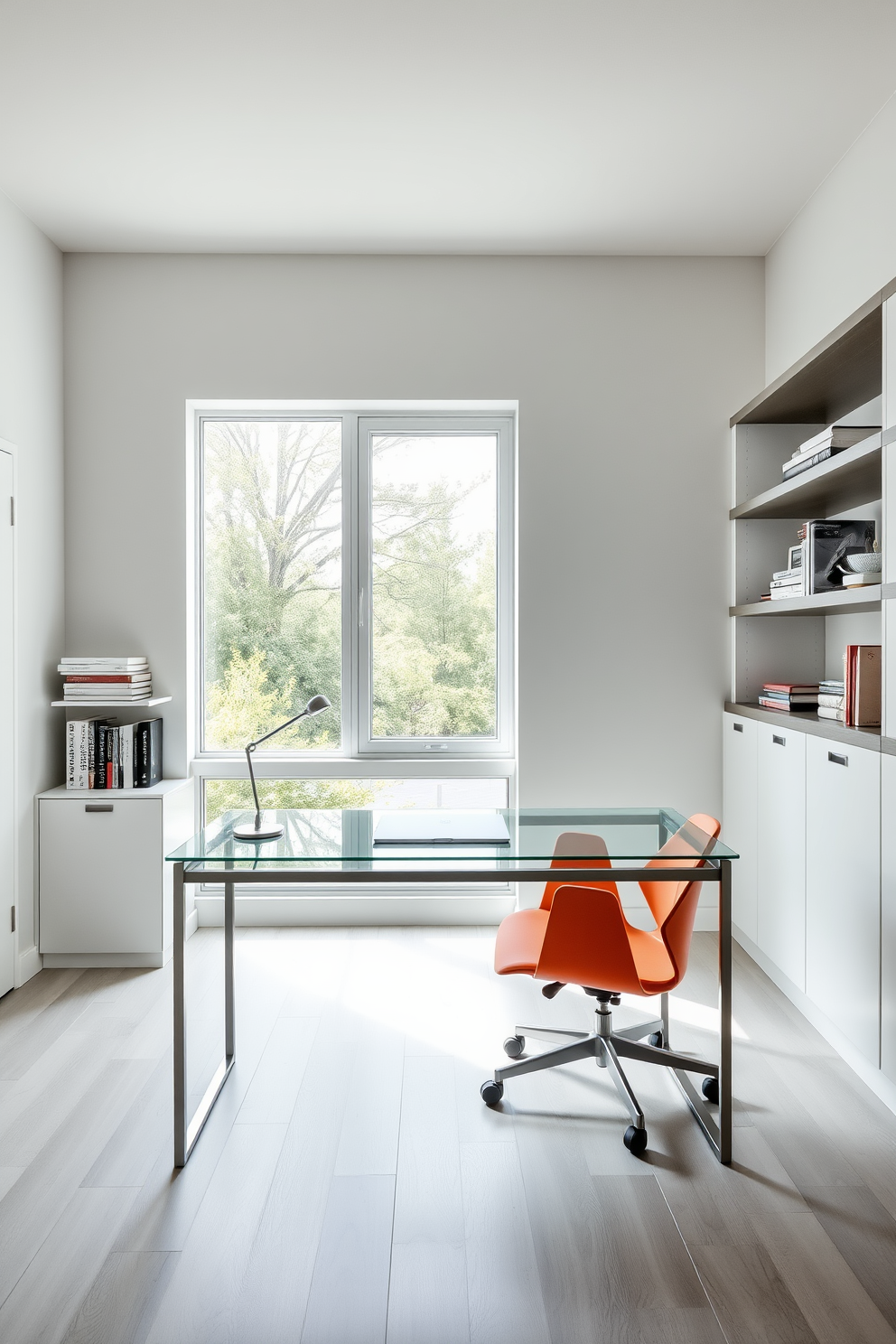 A sleek modern home office features a minimalist desk with a glass top and a simple metal frame. Behind the desk, a large window allows natural light to fill the space, highlighting the neutral color palette of whites and grays. The walls are adorned with floating shelves that display curated books and decorative items. A comfortable ergonomic chair in a bold color adds a pop of personality to the otherwise understated design.