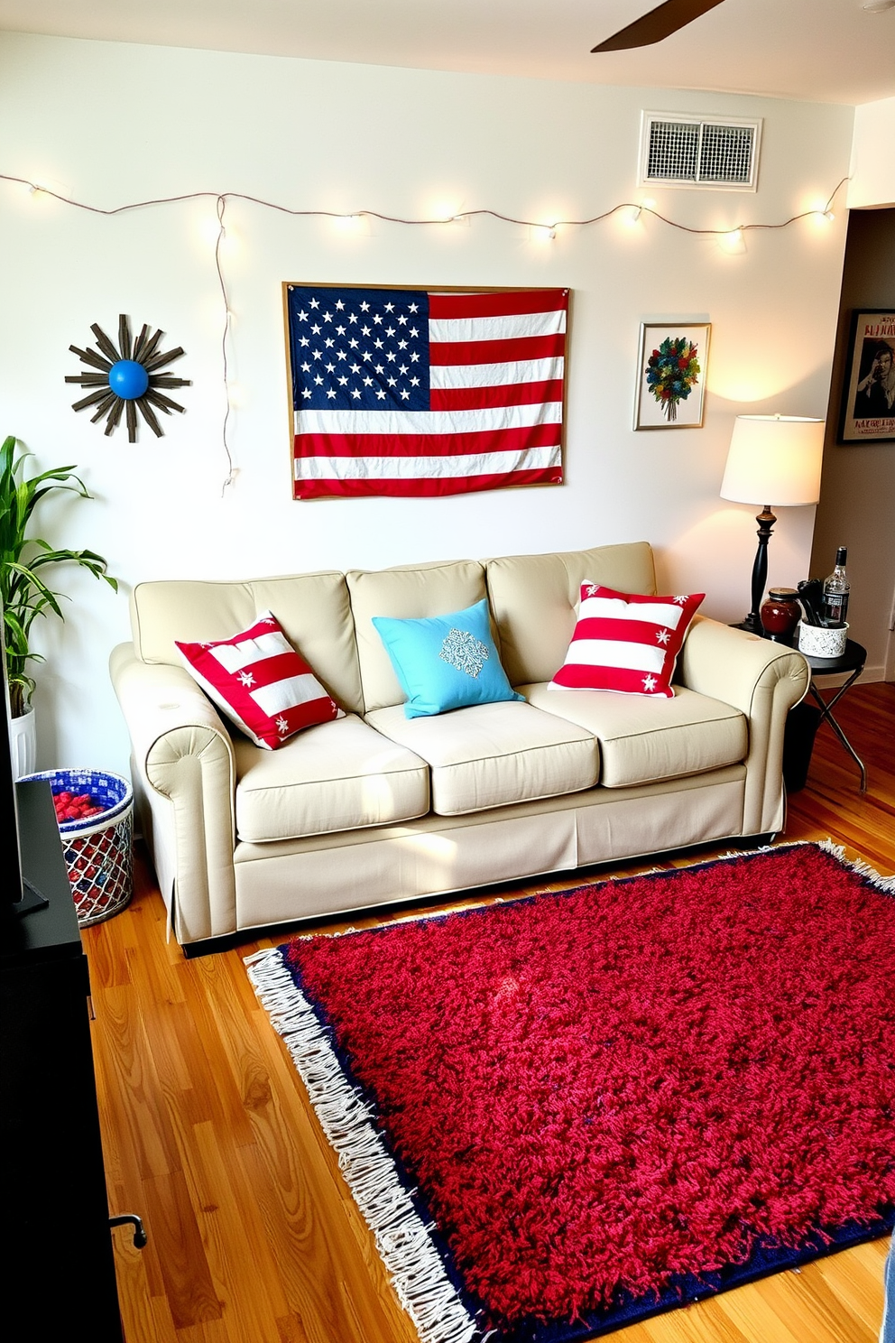 A patriotic themed door mat welcomes guests at the entrance, featuring bold red, white, and blue colors with stars and stripes. Surrounding the mat, potted plants with vibrant flowers add a festive touch, enhancing the spirit of Independence Day. Inside the apartment, red and white striped throw pillows adorn the couch, complemented by a blue blanket draped over the armrest. Wall art depicting iconic American symbols and framed photographs of past Independence Day celebrations create a cohesive festive atmosphere.