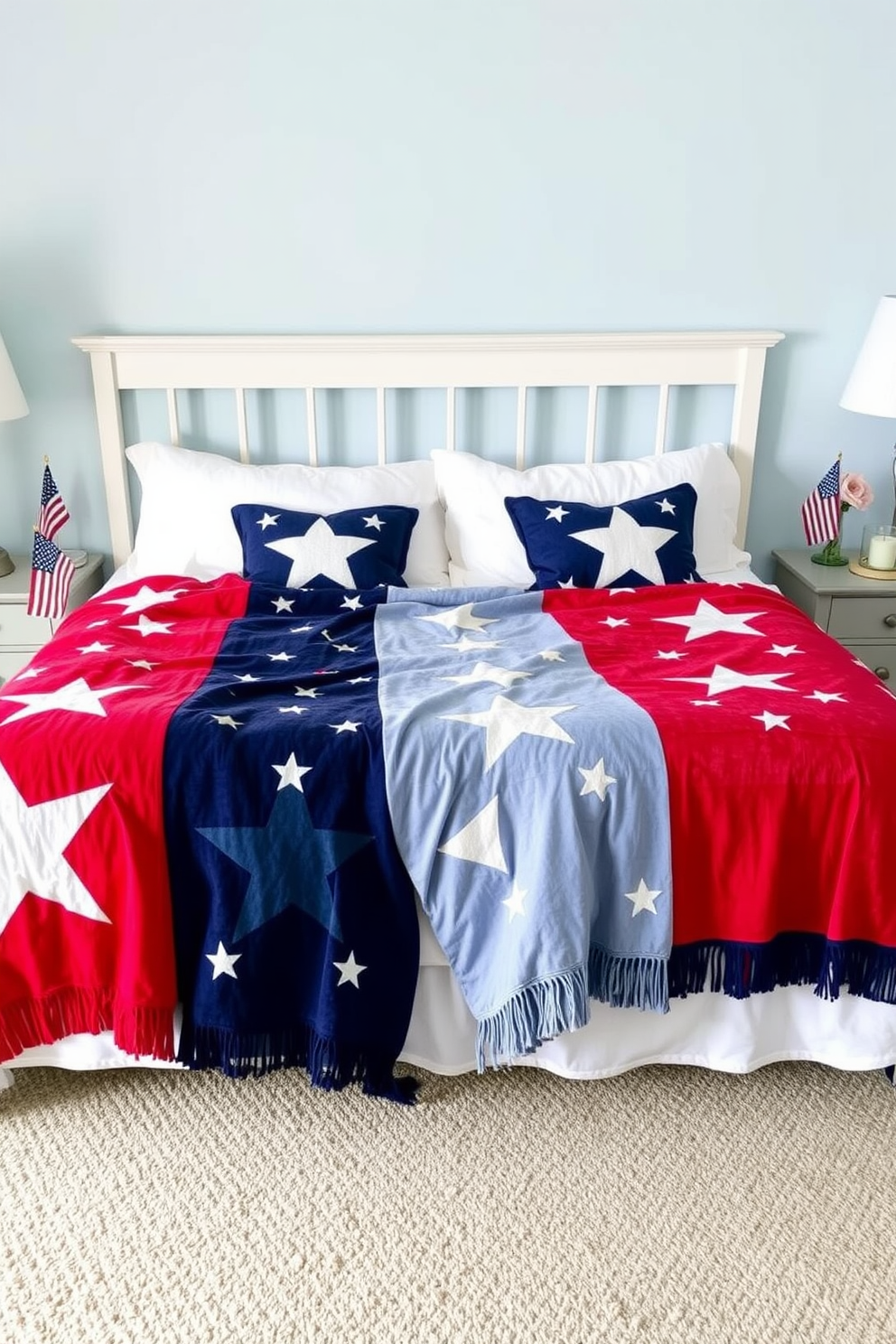 A cozy bedroom setting inspired by Independence Day. The bed is adorned with throw blankets featuring star patterns in red, white, and blue, creating a festive atmosphere. On the nightstands, small American flags are placed alongside decorative candles. The walls are painted in a soft blue hue, complementing the patriotic theme of the room.