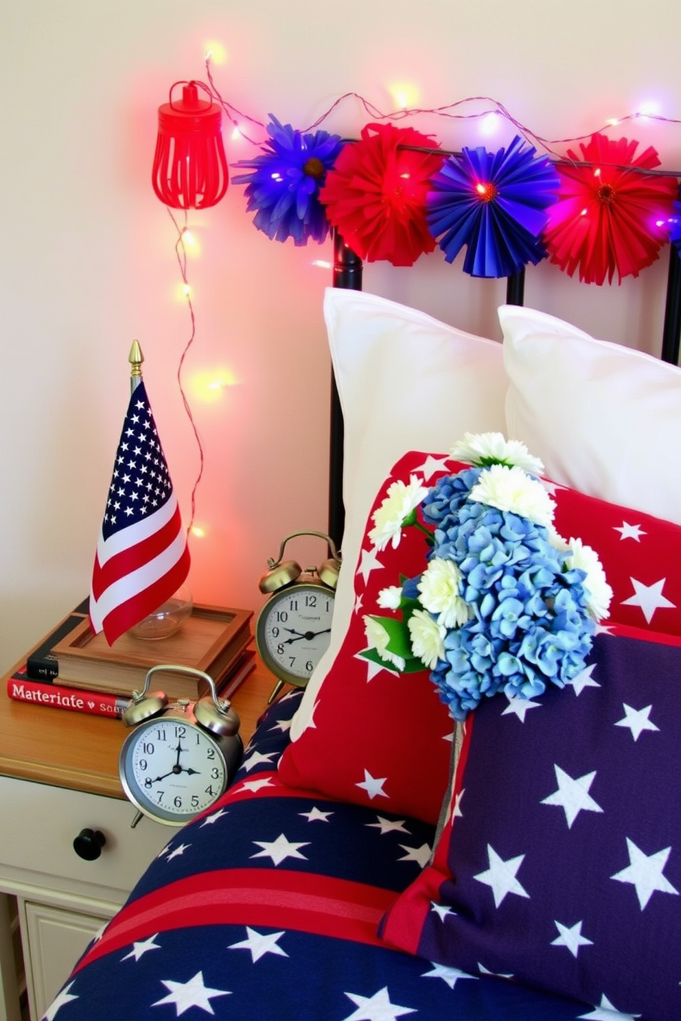 A patriotic bedroom setting featuring a star spangled banner elegantly draped over the headboard. The walls are painted in a soft blue hue, complemented by white bedding adorned with red and blue accents.