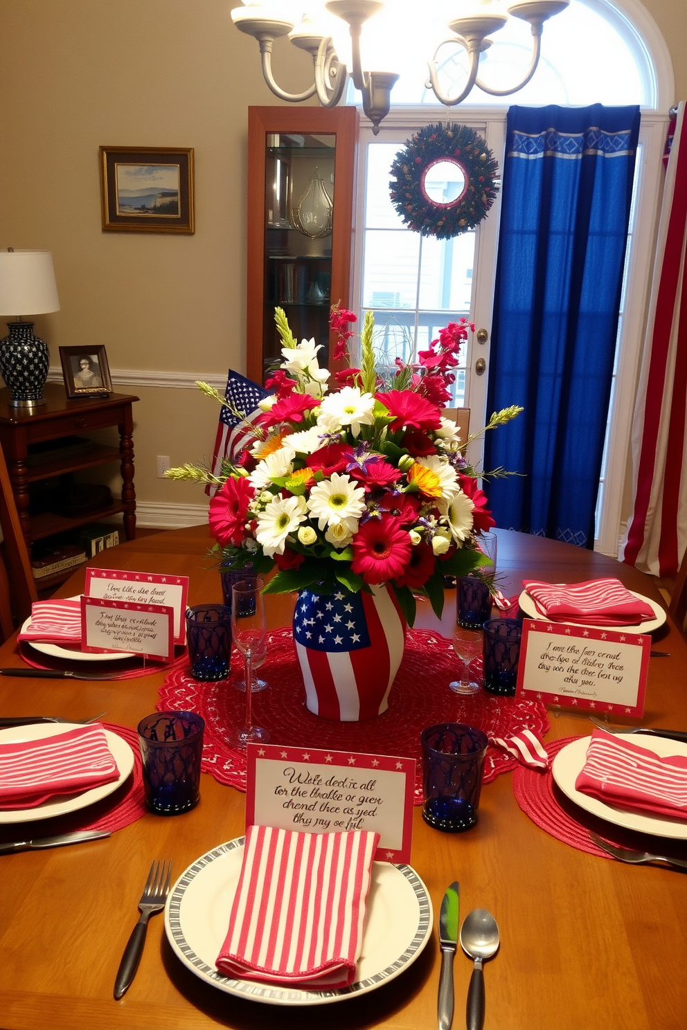 A festive dining room setting decorated for Independence Day. The table is adorned with red and blue striped table napkins, complementing a centerpiece of fresh flowers in patriotic colors.