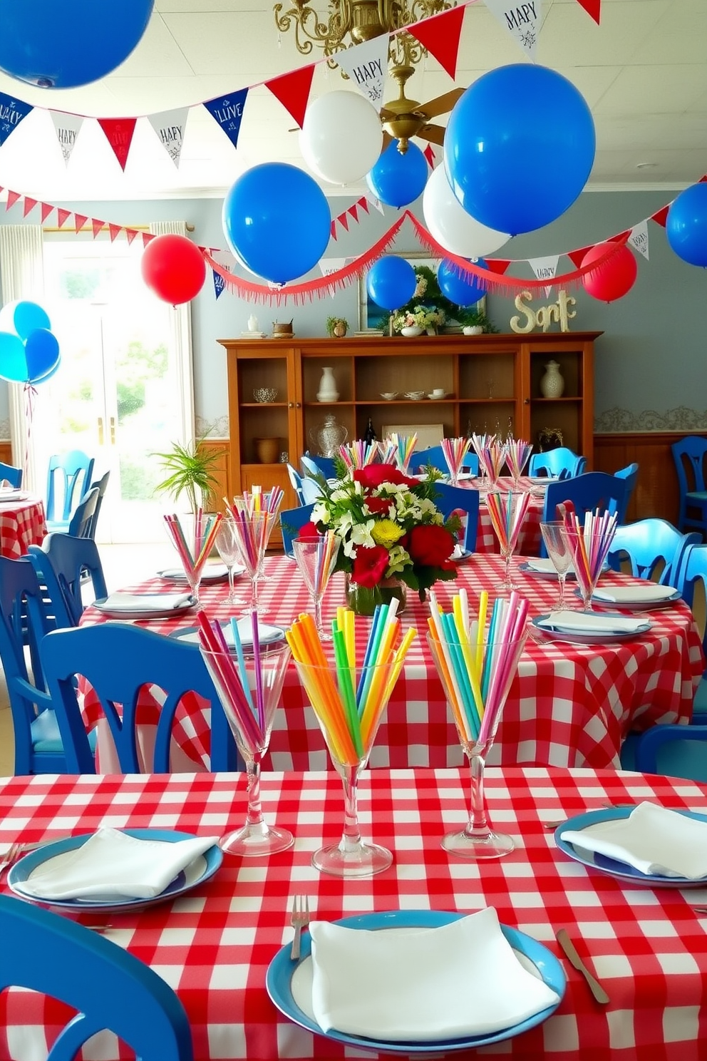 A vibrant dining room setting adorned with colorful straws in festive drinkware. The table is elegantly set with a red and white checkered tablecloth, surrounded by blue chairs and a centerpiece of fresh flowers. Banners and balloons in red, white, and blue hang from the ceiling, adding to the celebratory atmosphere. Each place setting features a unique drinkware piece filled with colorful straws, inviting guests to enjoy their beverages in style.