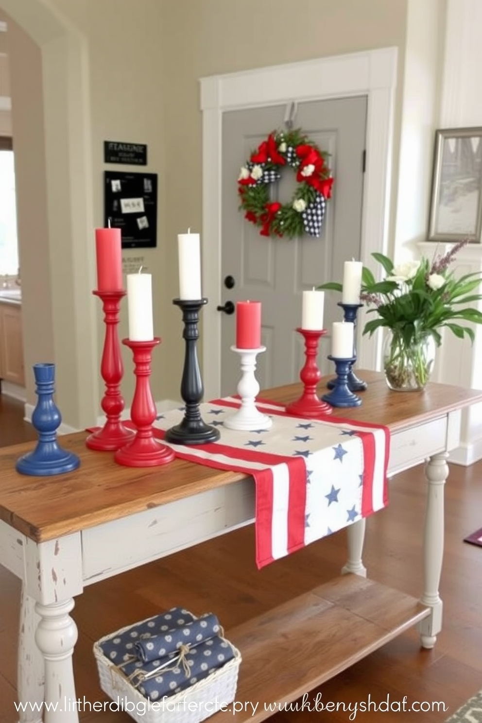 Candle holders painted in red white and blue are arranged on a rustic wooden console table in the entryway. The table is adorned with a festive runner featuring stars and stripes, creating a welcoming atmosphere for Independence Day celebrations.