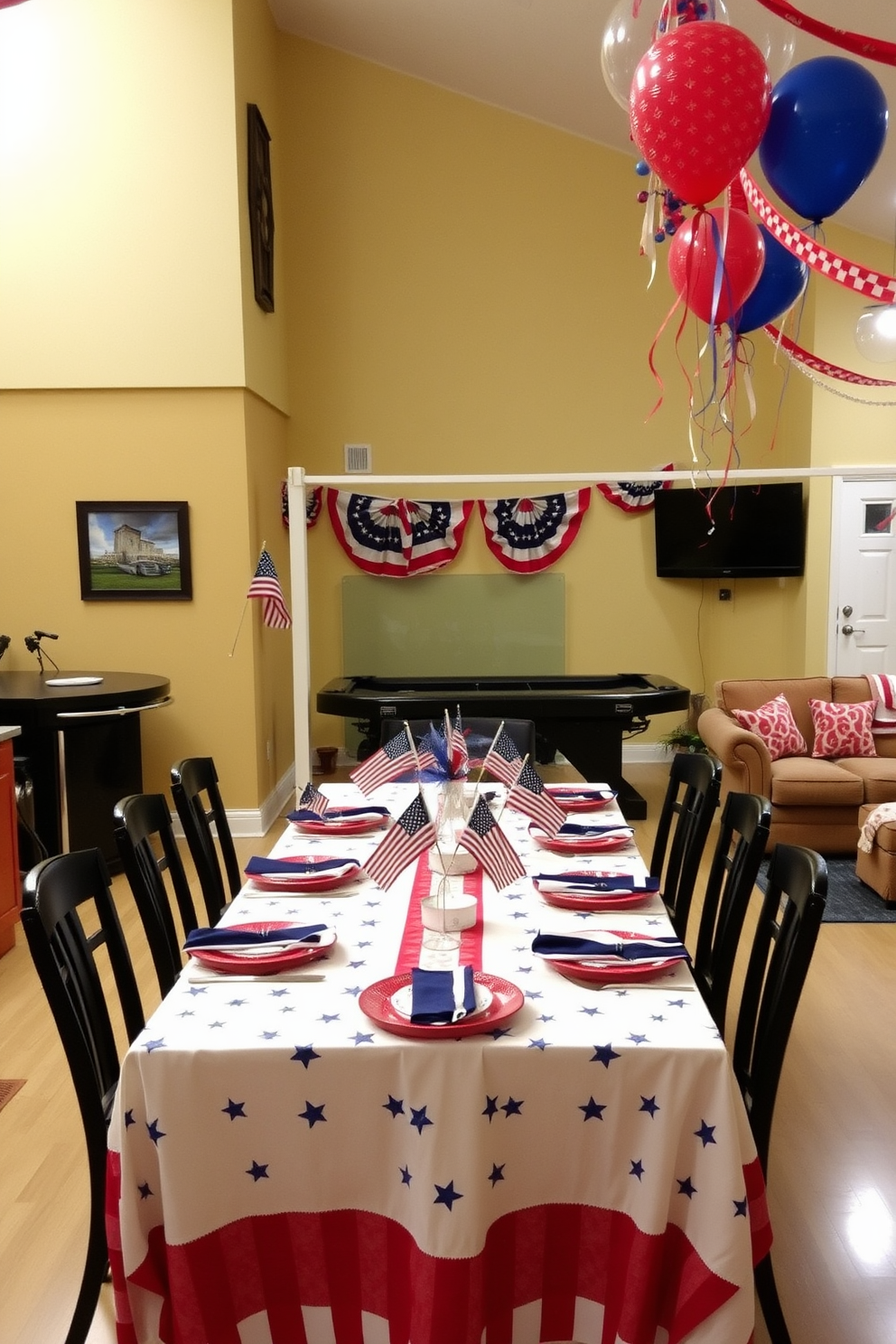 A festive tablecloth adorned with stars and stripes drapes elegantly over a long dining table. The table is set with red, white, and blue dinnerware, complemented by sparkling centerpieces featuring miniature American flags. In the game room, vibrant decorations celebrate Independence Day with themed balloons and streamers. A cozy seating area is arranged with patriotic throw pillows, creating a welcoming atmosphere for friends and family to gather and enjoy the festivities.