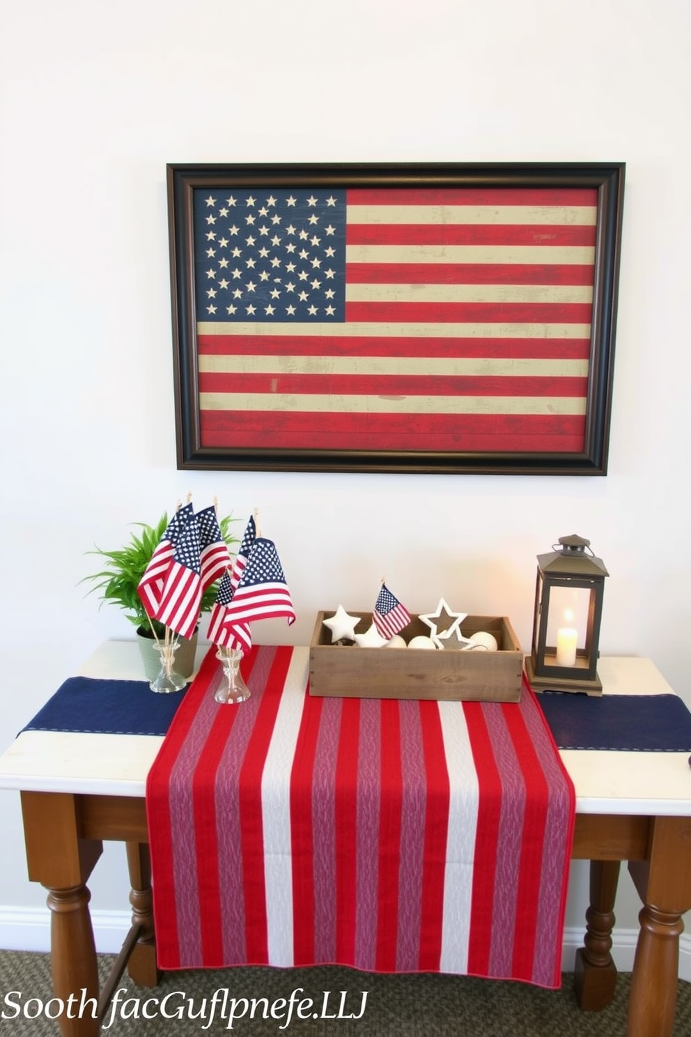 A patriotic themed entryway table is adorned with a vibrant red white and blue runner that stretches across the surface. On the table sits a collection of small American flags in decorative holders alongside a rustic wooden box filled with star shaped ornaments. The wall above the table features a framed artwork depicting a vintage American flag with a distressed finish. To the side of the table, a potted plant adds a touch of greenery while a small lantern illuminates the space with a warm inviting glow.