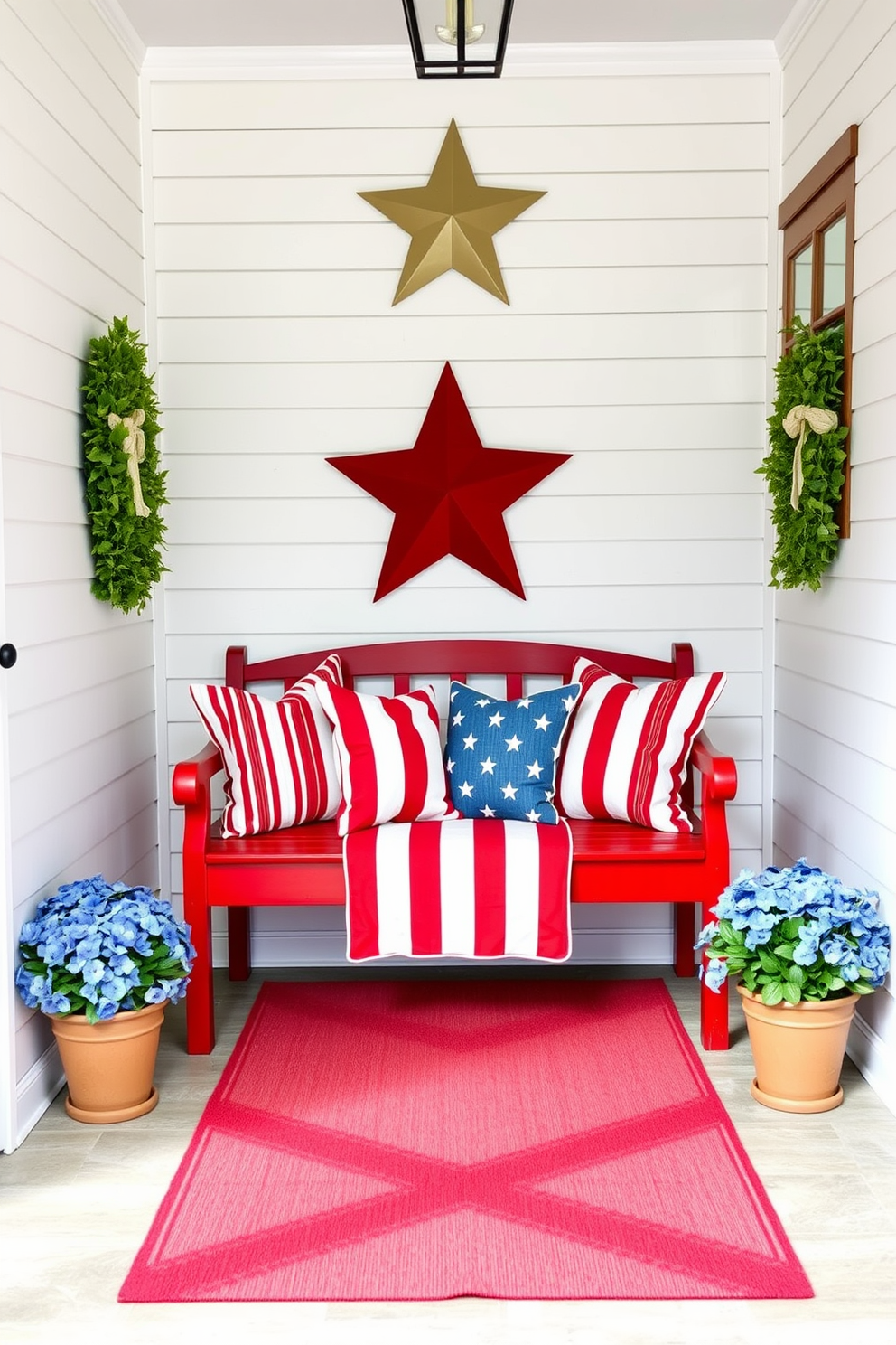 A vibrant entryway featuring a red white and blue themed bench that serves as a focal point. The bench is adorned with patriotic cushions and is placed against a backdrop of white shiplap walls, creating a welcoming atmosphere for Independence Day celebrations. Decorative elements such as star-shaped wall art and a red and white striped runner enhance the festive spirit. Potted plants with blue flowers flank the bench, adding a touch of nature and color to the hallway.