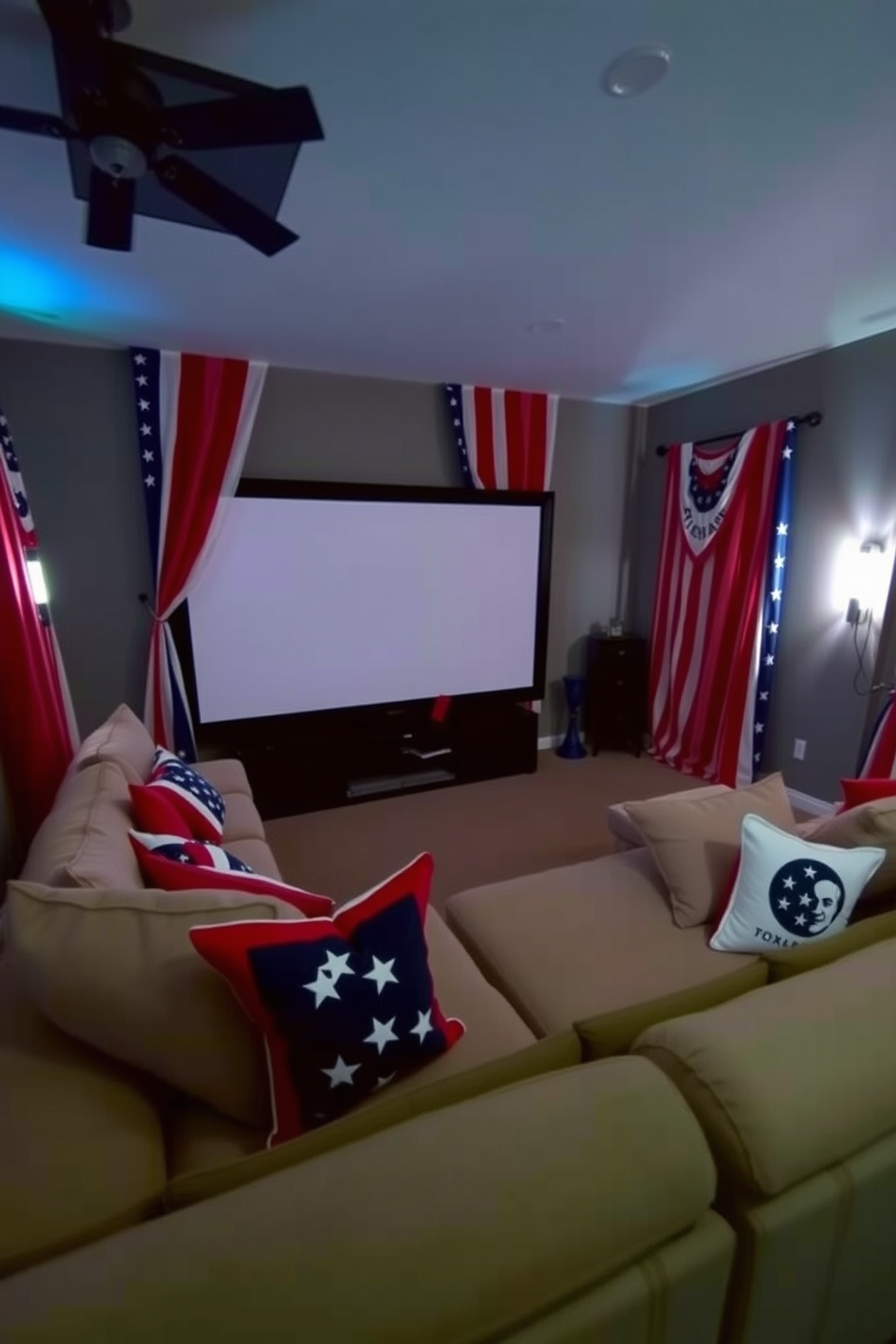 A cozy home theater setting decorated for Independence Day. The windows are adorned with stars and stripes curtains that create a festive atmosphere. A plush sectional sofa is positioned in front of a large screen, surrounded by patriotic-themed throw pillows. Dimmed lighting enhances the cinematic experience, while red, white, and blue accents add a celebratory touch.