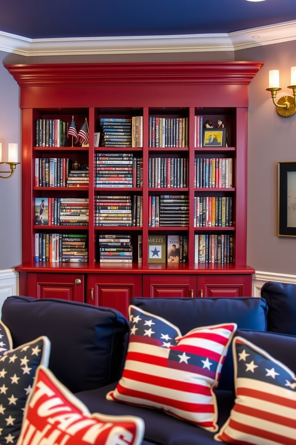 A patriotic themed DVD collection display features a custom-built wooden cabinet painted in red white and blue. The shelves are filled with an array of DVDs showcasing classic American films alongside decorative elements like small flags and themed memorabilia. The home theater is designed with comfortable seating upholstered in navy blue fabric. Accent pillows in stars and stripes patterns add a festive touch while wall sconces in antique brass provide warm ambient lighting for a cozy movie night atmosphere.