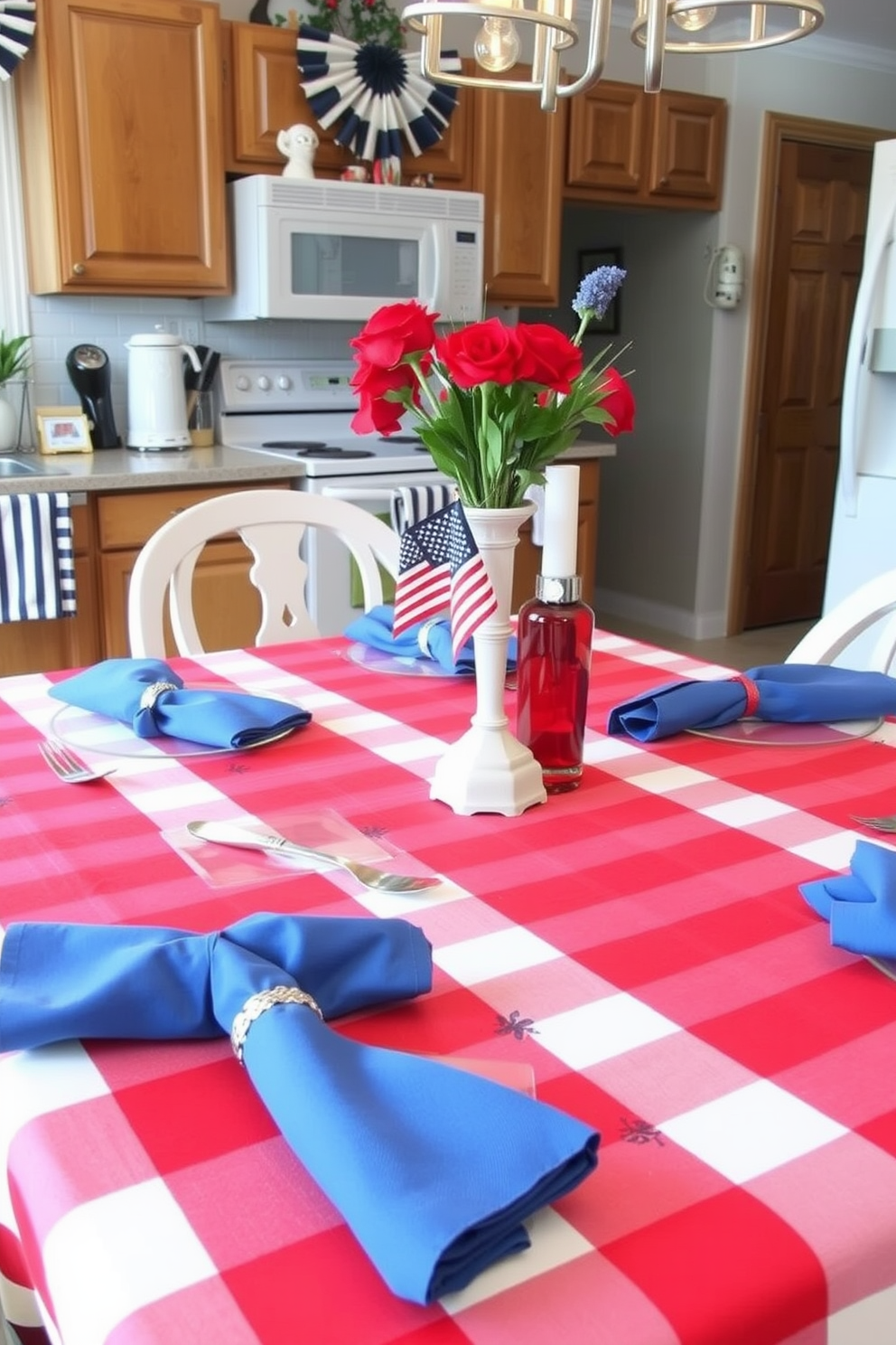 A festive kitchen setting is adorned with a red white and blue tablecloth draping elegantly over a rustic wooden dining table. The table is set with matching plates and napkins, and a centerpiece of fresh flowers in patriotic colors adds a vibrant touch.